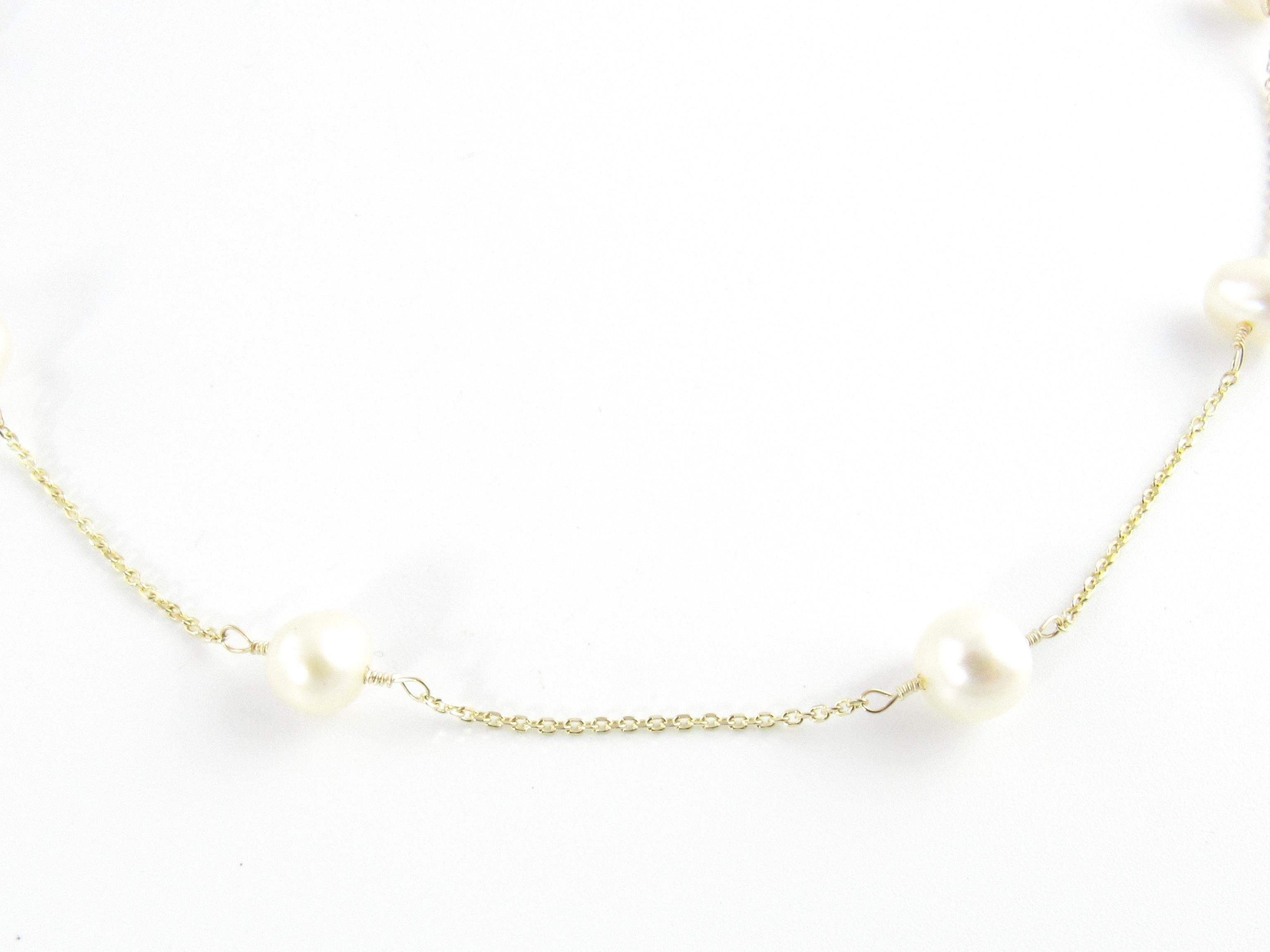Vintage 14 Karat Yellow Gold and Pearl Necklace

This stunning necklace features ten lovely pearls (7 mm each) set on a classic 14K yellow gold chain.

Size: 16.25 inches

Weight: 3.8 dwt. / 6.0 gr.

Stamped: 14K

Very good condition, professionally