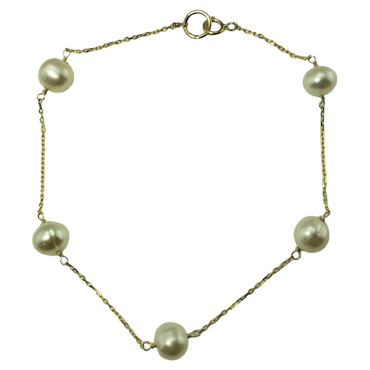 Bracelet station en or jaune 14 carats et perles n°13302