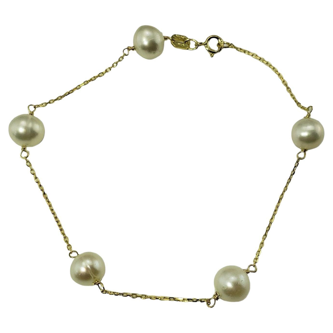 Bracelet station en or jaune 14 carats et perles n°13324 en vente