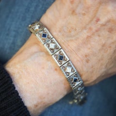 Bracciale ornato in oro giallo 14 carati e platino con diamanti e zaffiri