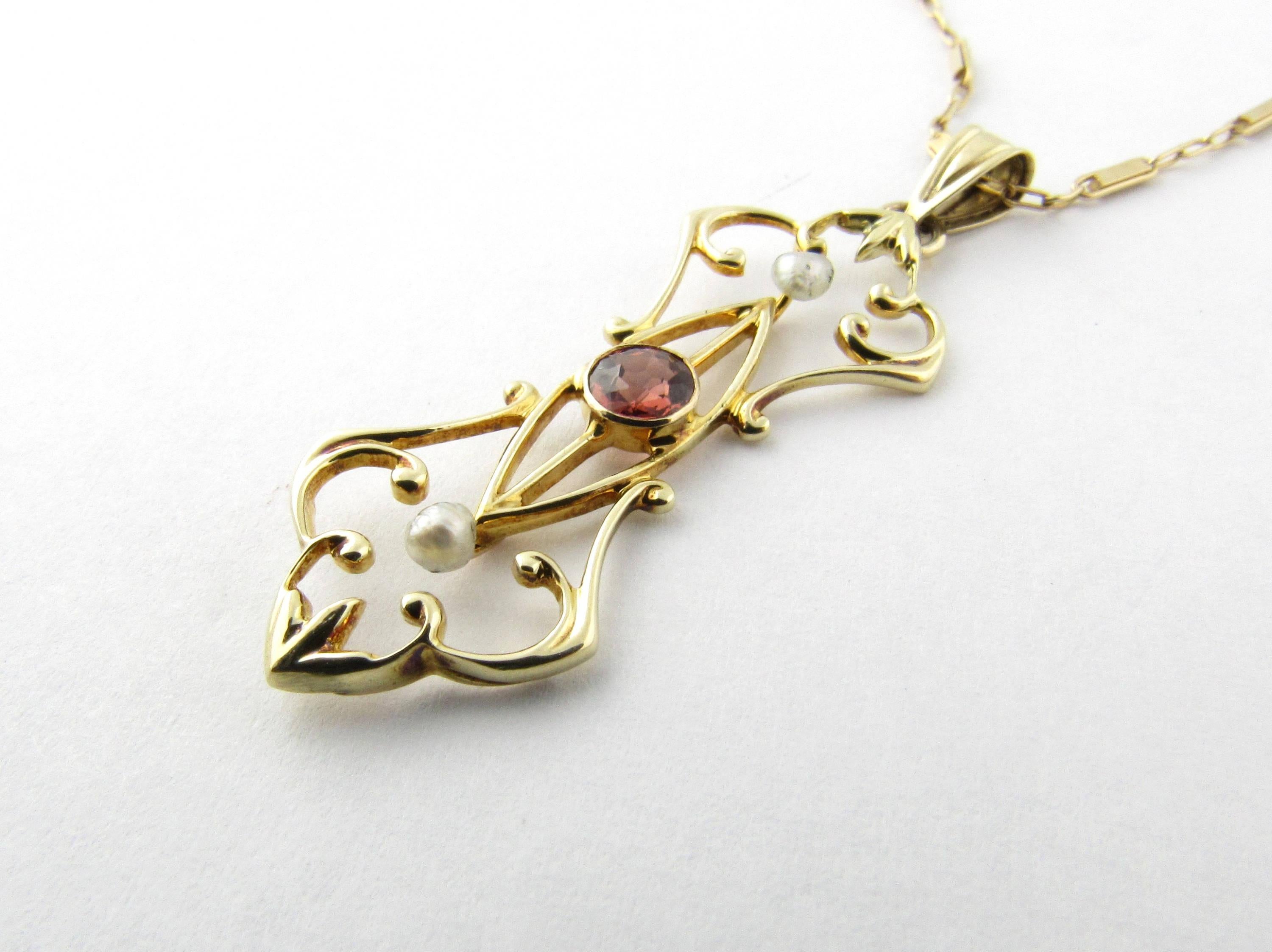 Vintage 14 Karat Yellow Gold and Rhodolite Garnet Pendant-

This unique custom made pendant was upscaled from a vintage pin and features a rhodolite garnet (4 mm) accented with two seed pearls and set in ornate 14K gold on a lovely 18 inch 14K gold