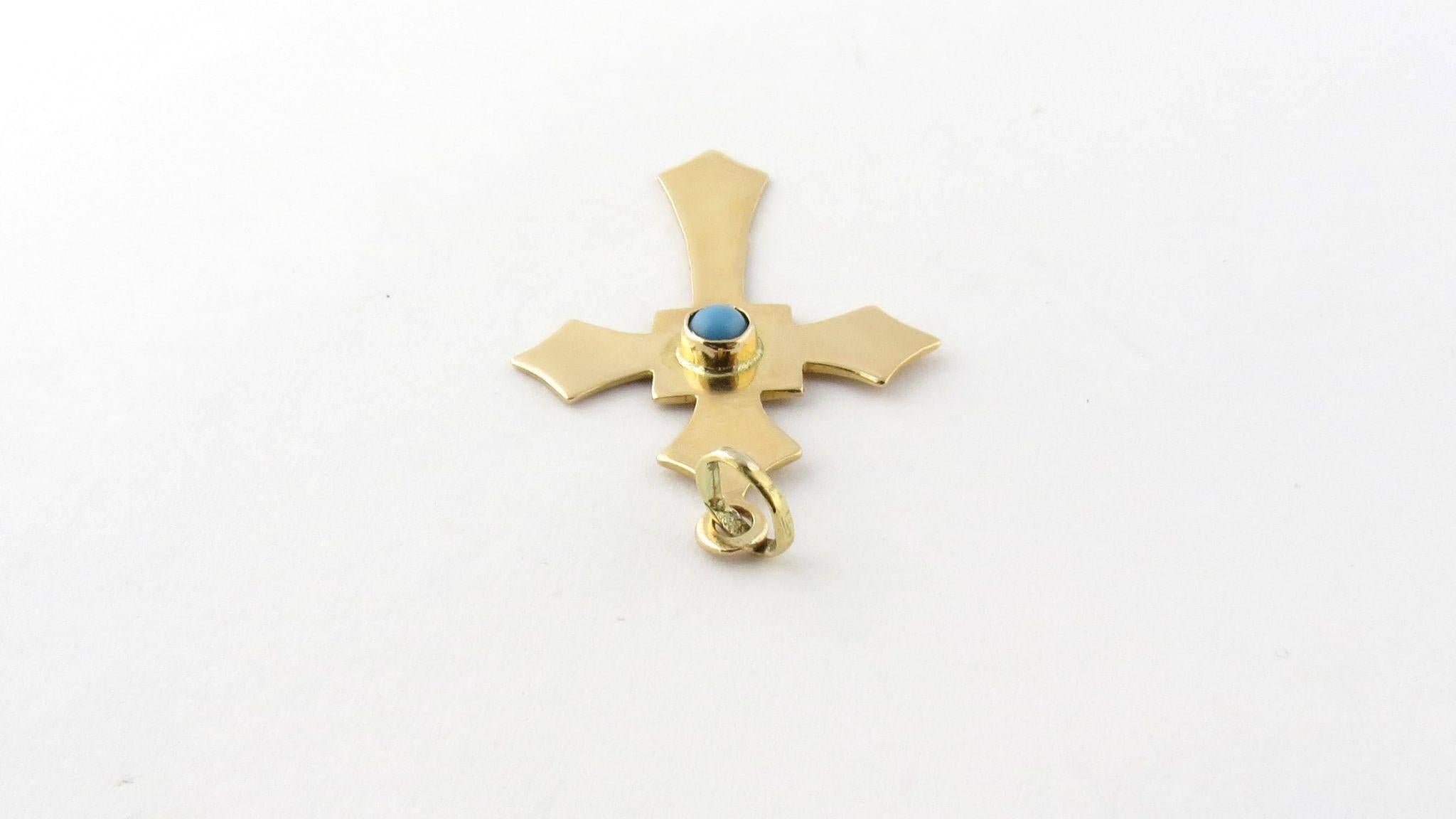 Vintage 14K Yellow Gold and Robin Egg Turquoise Cross Pendant 

This cross pendant is centered with a gorgeous robin egg blue turquoise stone. 

It measures 45 mm in length from the top of the bale. 

25 mm across. 

The stone is approximately 4 mm