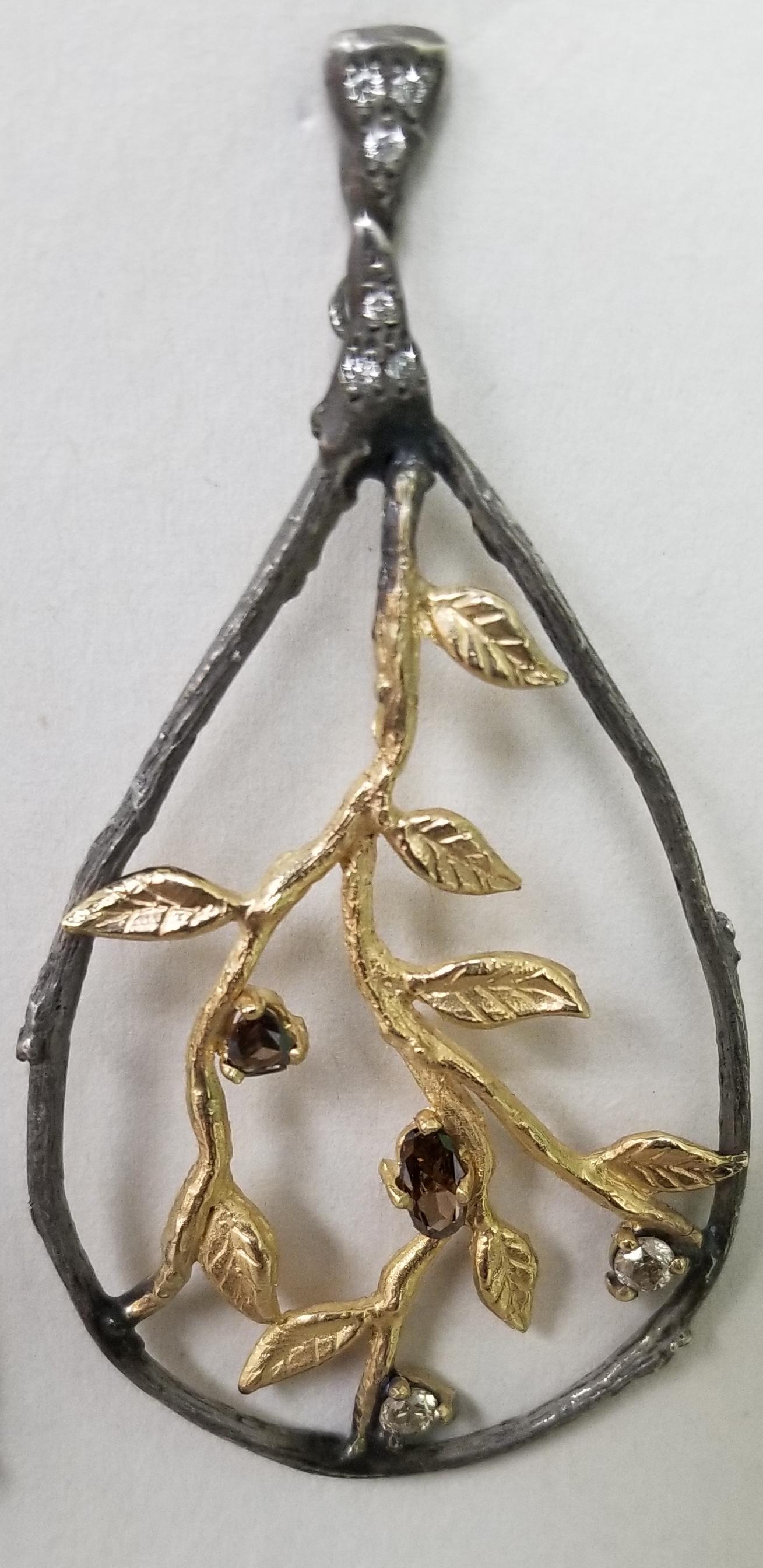 14k yellow gold and silver Gresha signature bark and leaf with natural white and brown colored diamonds weighing 1.20cts.  the silver has been black antiqued.

*this design is ours and can be created in any other form; ring, necklace, bracelet, or
