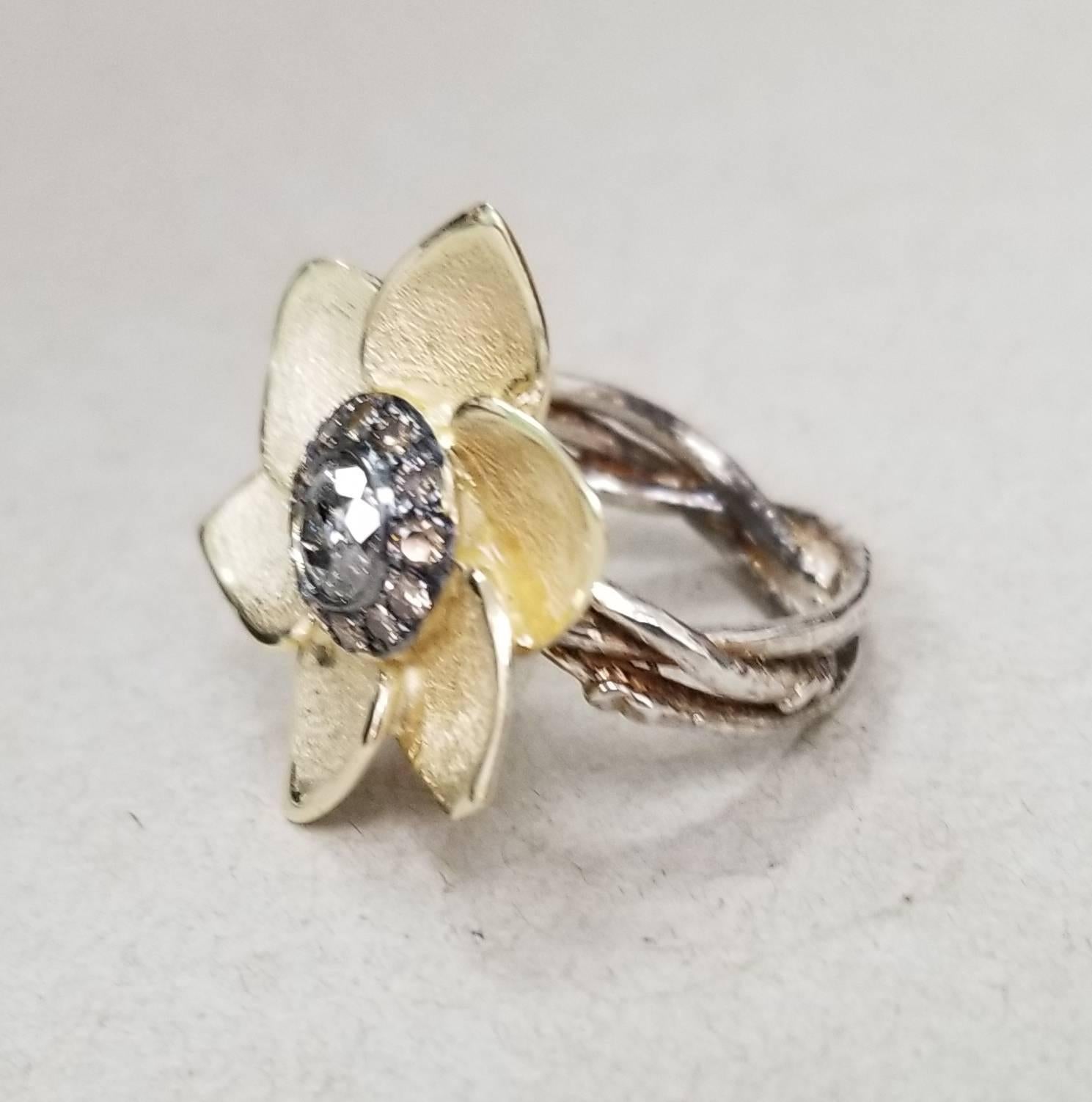 14k yellow gold and silver Gresha signature bark diamond ring containing 1 round brilliant cut diamond .51pts. and 12 brown diamonds weighing .30pts. set in a 6 pedal flower on a silver braided bark ring.  size 6.5 
*this design is ours and can be