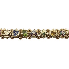 14 Karat Yellow Gold and Simulated Gemstone Charm Bracelet