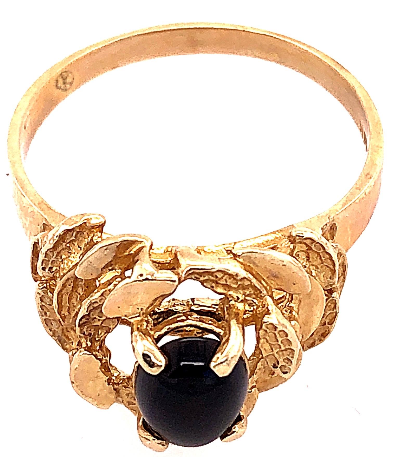 Oval Cut 14 Karat Yellow Gold and Solitaire Cabochon Onyx Contemporary Ring For Sale
