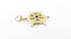 14 Karat Yellow Gold and Synthetic Ruby Ship's Wheel Pendant