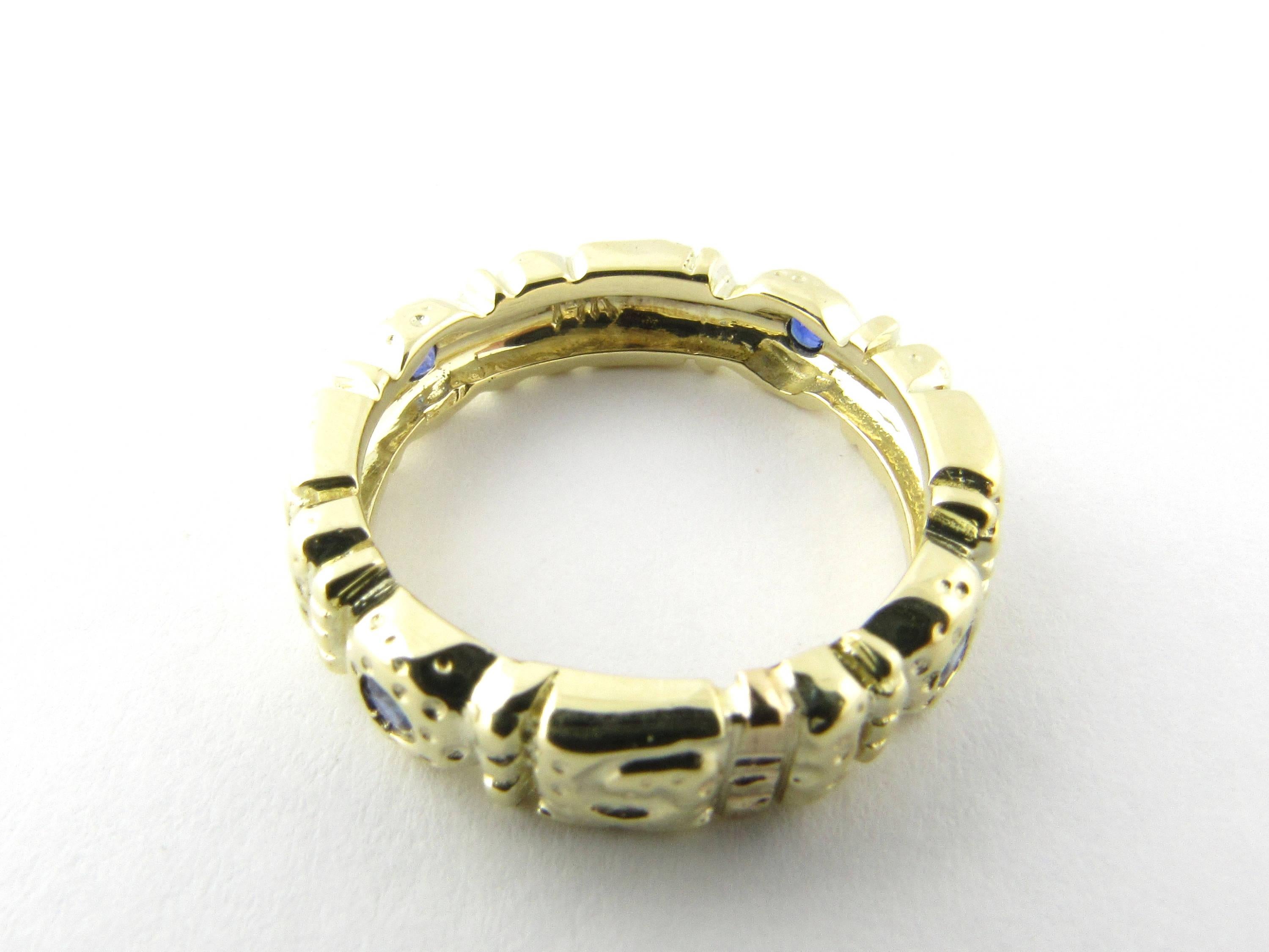 Vintage 14 Karat Yellow Gold and Tanzanite Ring Size 6.75- 
This lovely ring features four genuine blue tanzanites (2 mm) set in a meticulously detailed 14K yellow gold band. Ring Width: 5 mm 
Ring Size: 6.75 
Weight: 3.2 dwt. /  5.1 gr. 
Hallmark:
