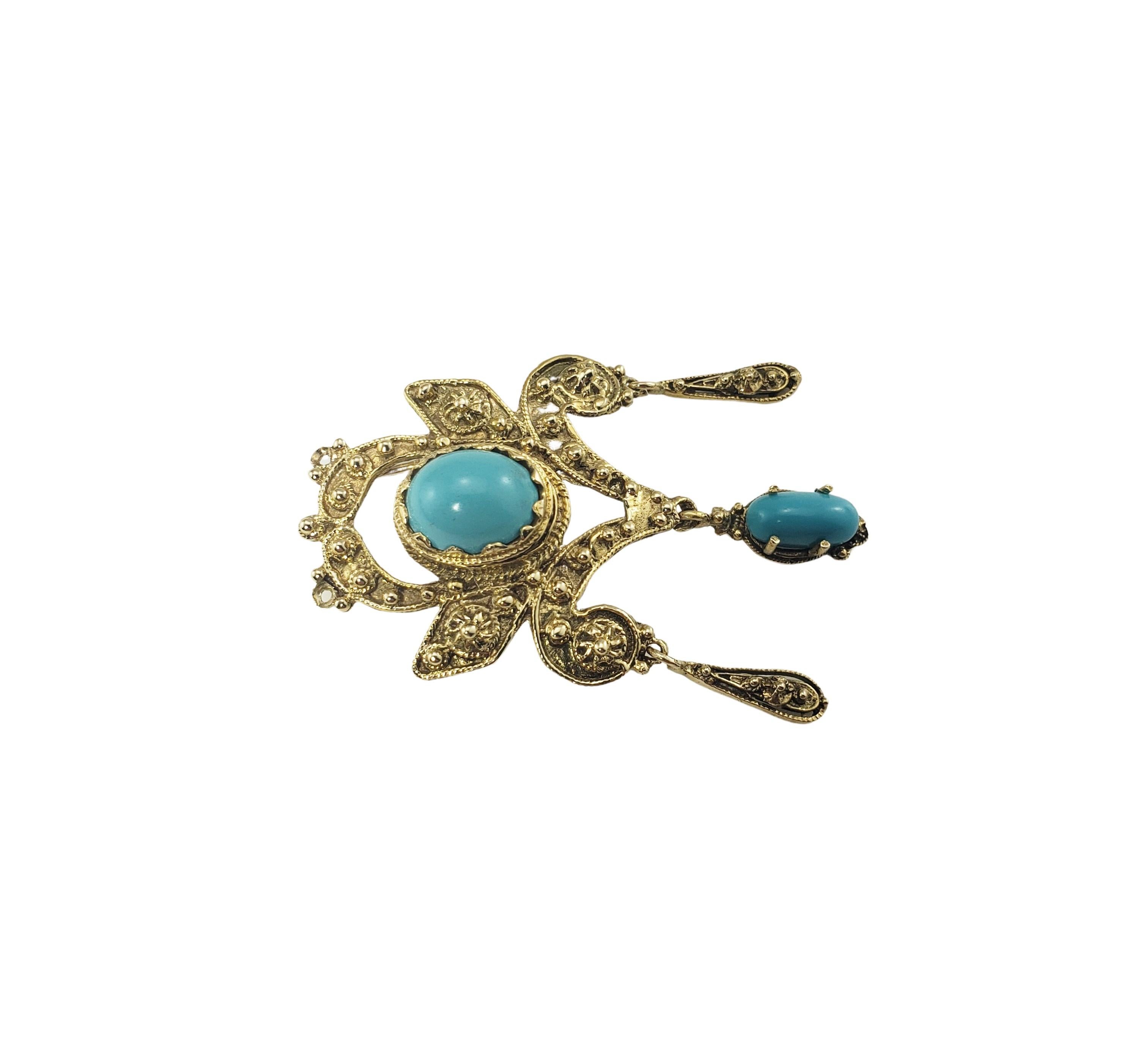 14 Karat Yellow Gold and Turquoise Brooch/Pendant-

This elegant brooch features two oval cabochon turquoise stones (large: 10 mm x 7 mm, small: (9 mm x 4 mm) set in beautifully detailed 14K yellow gold.  Can be worn as a brooch or a pendant.

Size: