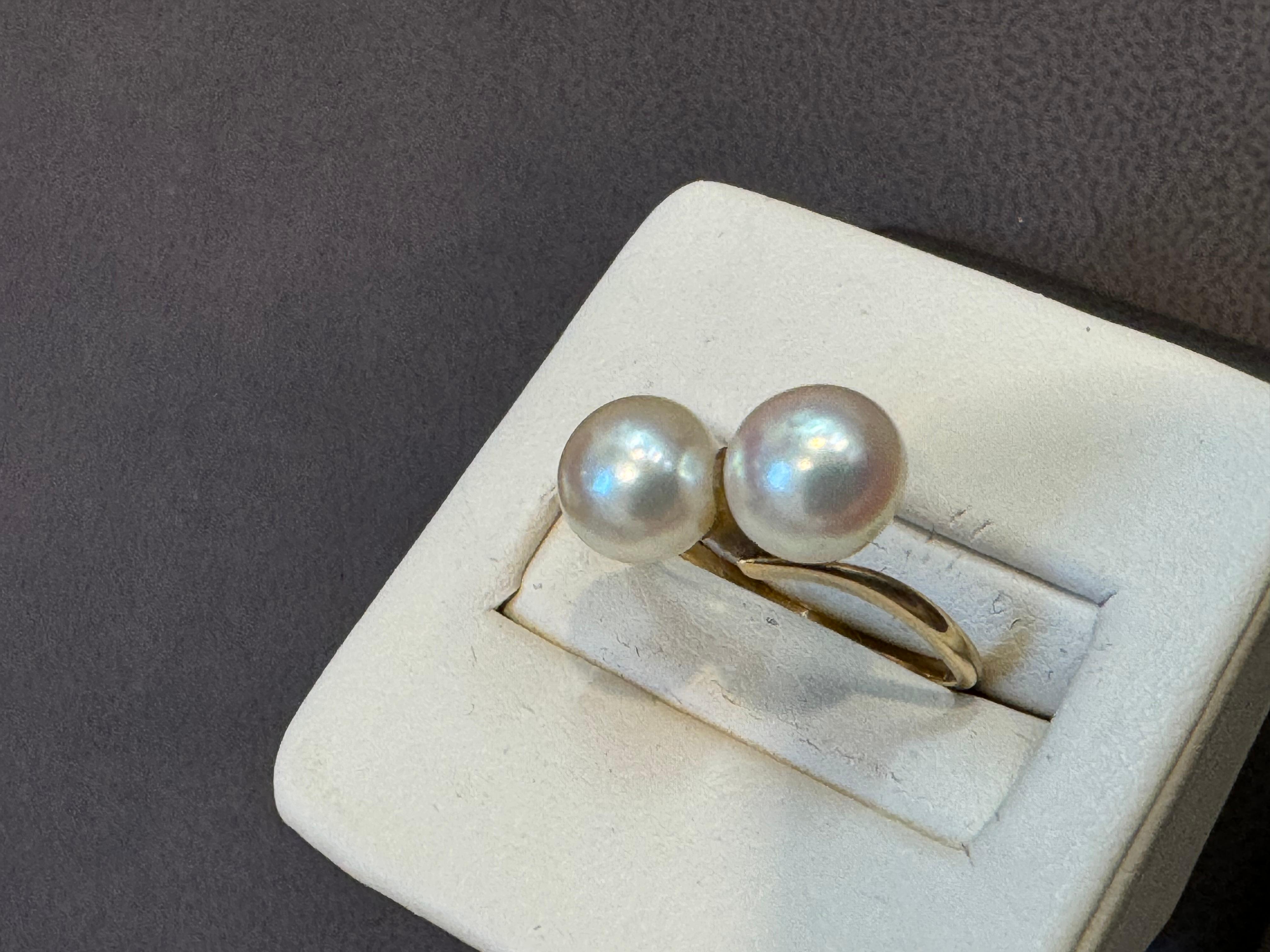 14 Karat Yellow Gold And Two Pearls Ring By Designer MIKIMOTO
Designer Piece 
Mikimoto is known to use the best Pearls always
 Beautiful pearl stone with shine and luster  
14 Karat yellow gold , stamped 
Weight 2.4 gm
Gold  for 14 K, stamped
Ring