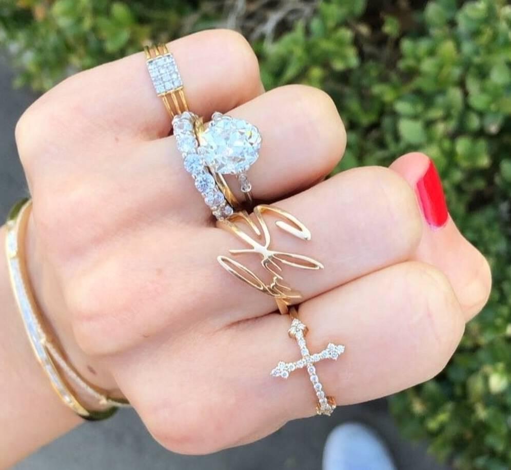The 14k gold and white diamond Cross Your Fingers ring is a delicate piece that conveys strength with our signature Gothic cross that sits horizontally across the finger.  It is lightweight and easy to layer or wear solo. 

This ring can be made in