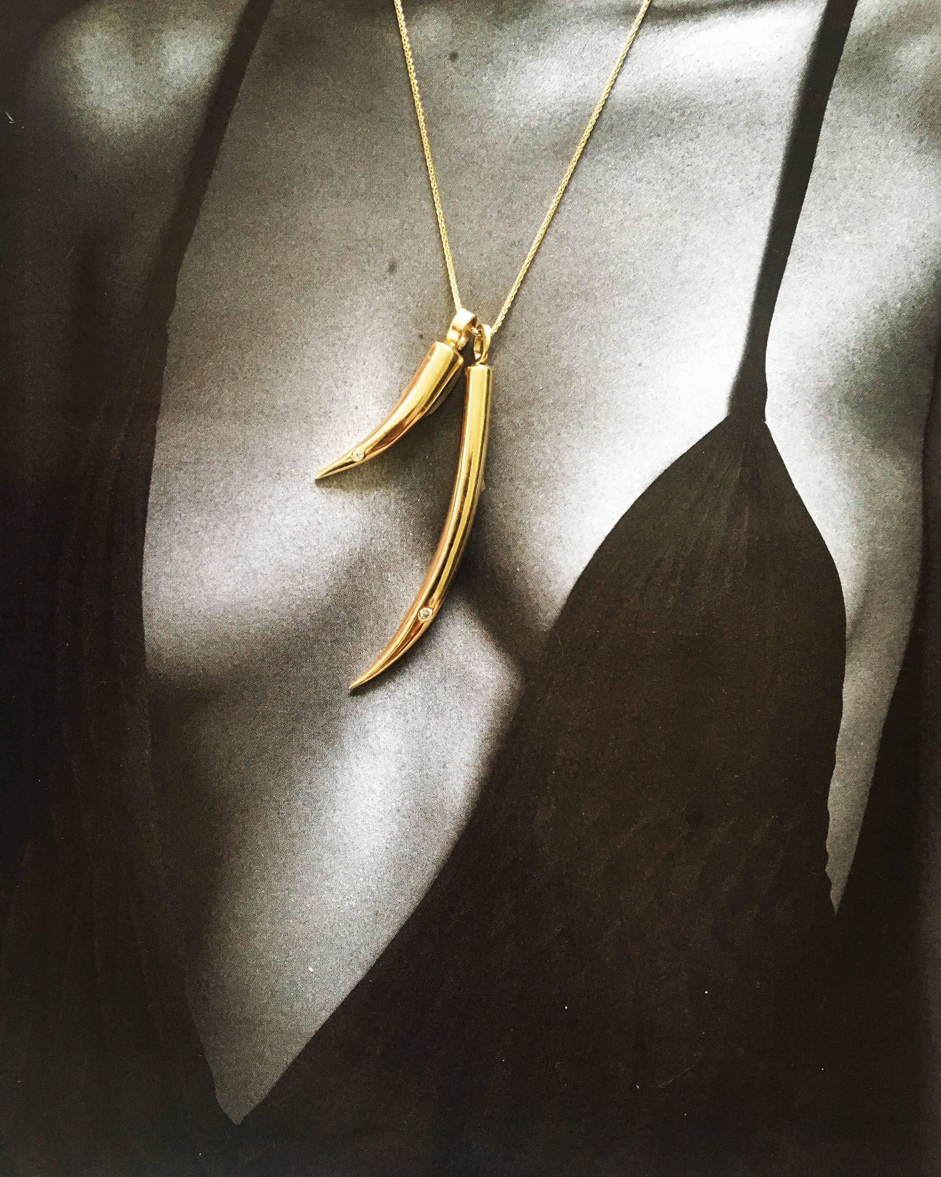 This large 14k gold tusk pendant has a sleek and sexy design meant to be worn long and solo, but equally alluring layered with other pendants.  It has a diamond set at the tip of the tusk to showcase the femininity of the piece.

The Large Tusk