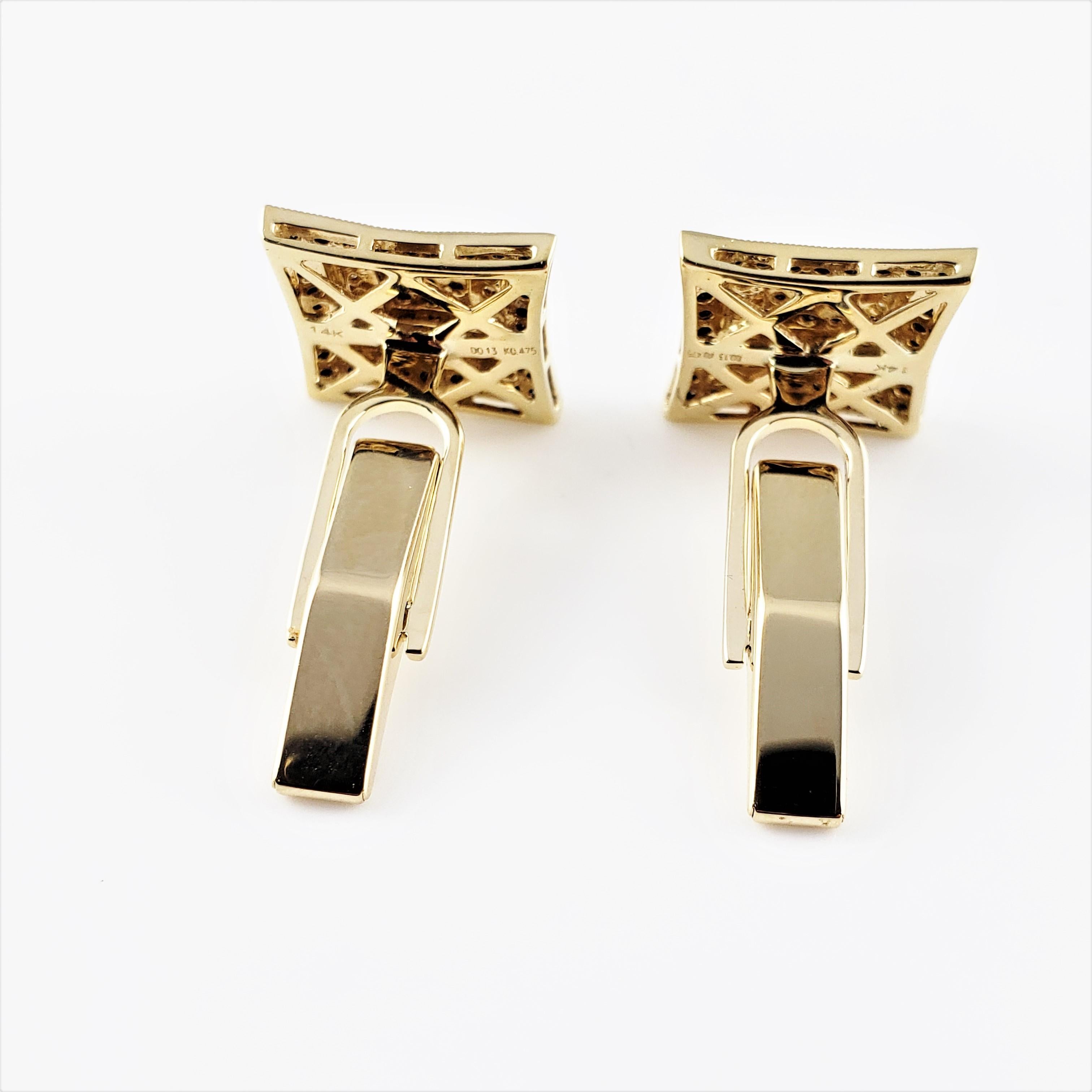 Vintage 14 Karat Yellow and White Gold Black and White Diamond Cufflinks-

These elegant cufflinks each feature 41 round black single cut diamonds and 24 round single cut diamonds set in classic 14K white and yellow gold.

Approximate total diamond