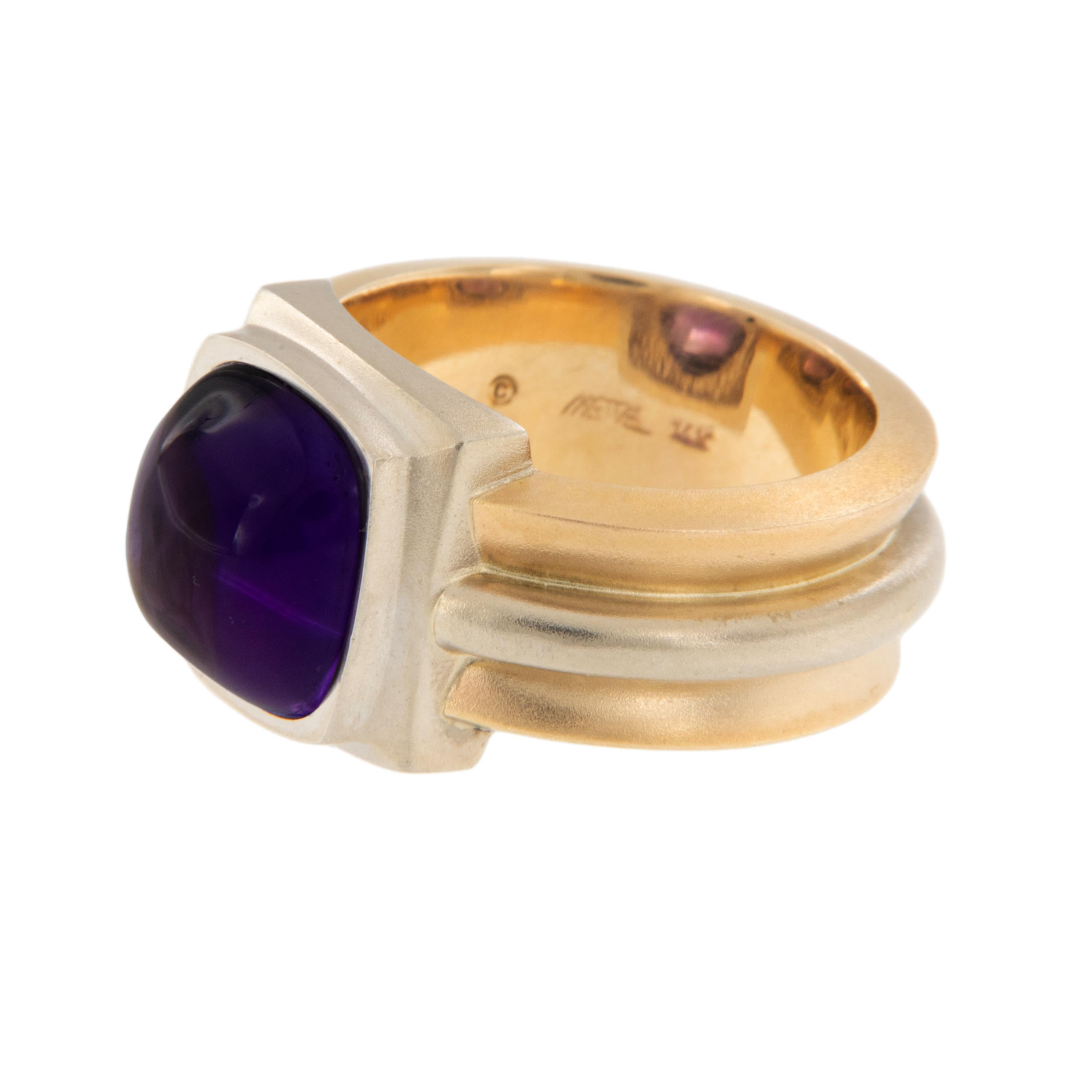 Patrick Irla is known for his beautifully executed contemporary jewelry. Hand assembled 14 karat yellow & white gold, this ring features a 10mm sugarloaf amethyst with gemmy color! Ring was made in a size 6, but can be sized. Complementary signature