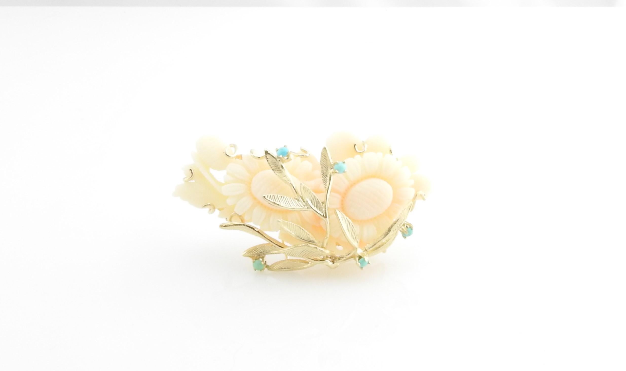 Vintage 14 Karat Yellow Gold Angel Skin Coral and Turquoise Brooch / Pin

This stunning floral brooch is crafted in lovely angel skin coral and accented with 14K yellow gold and five round turquoise gemstones.

Size: 63 mm x 35 mm

Weight: 18.7 dwt.