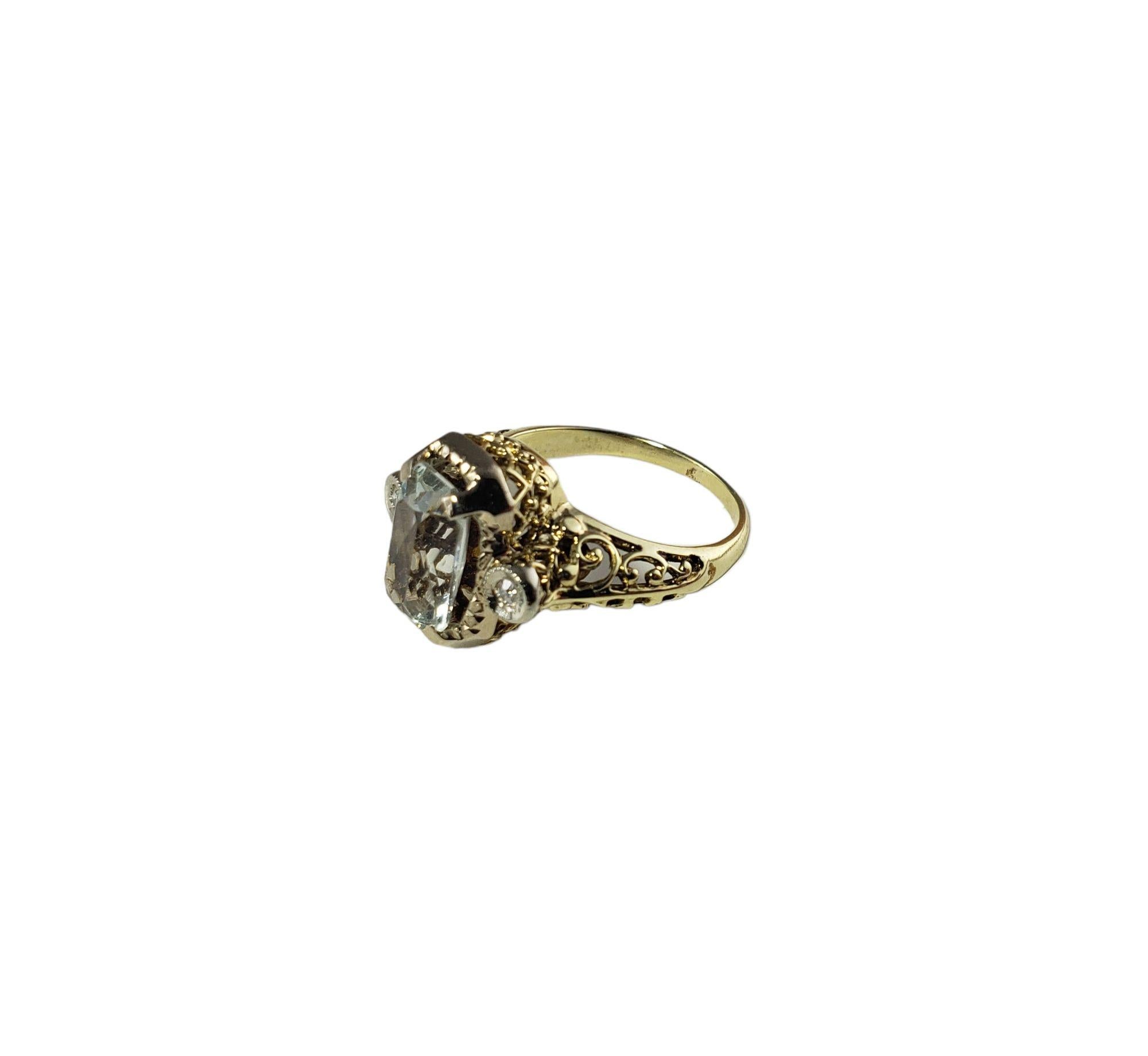 Vintage 14 Karat Yellow Gold Aquamarine and Diamond Ring Size 4.25 JAGi Certified-

This lovely ring features one aquamarine gemstone and two round single cut diamonds set in beautifully detailed 14K yellow gold. Width: 12 mm. Shank: 2