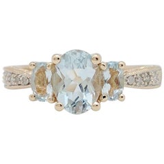 14 Karat Yellow Gold Aquamarine and Diamond Three-Stone Ring
