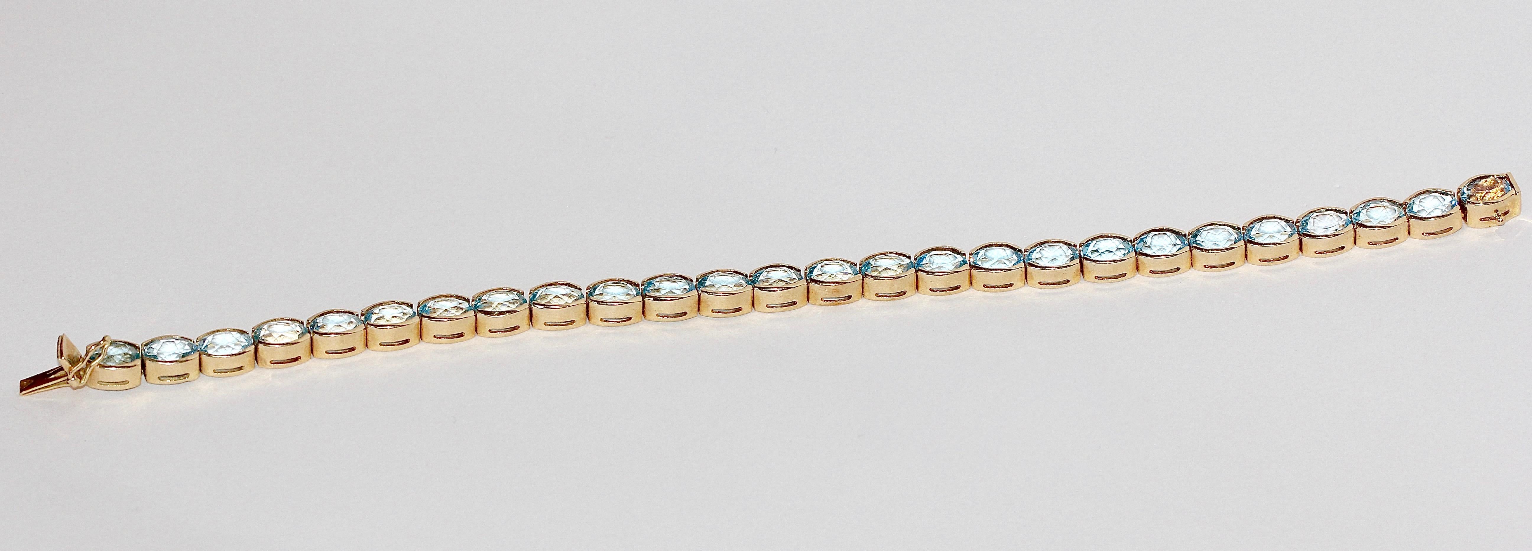 aquamarine tennis bracelet gold