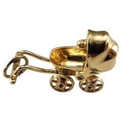 14 Karat Yellow Gold Articulated Baby Carriage Charm #19542