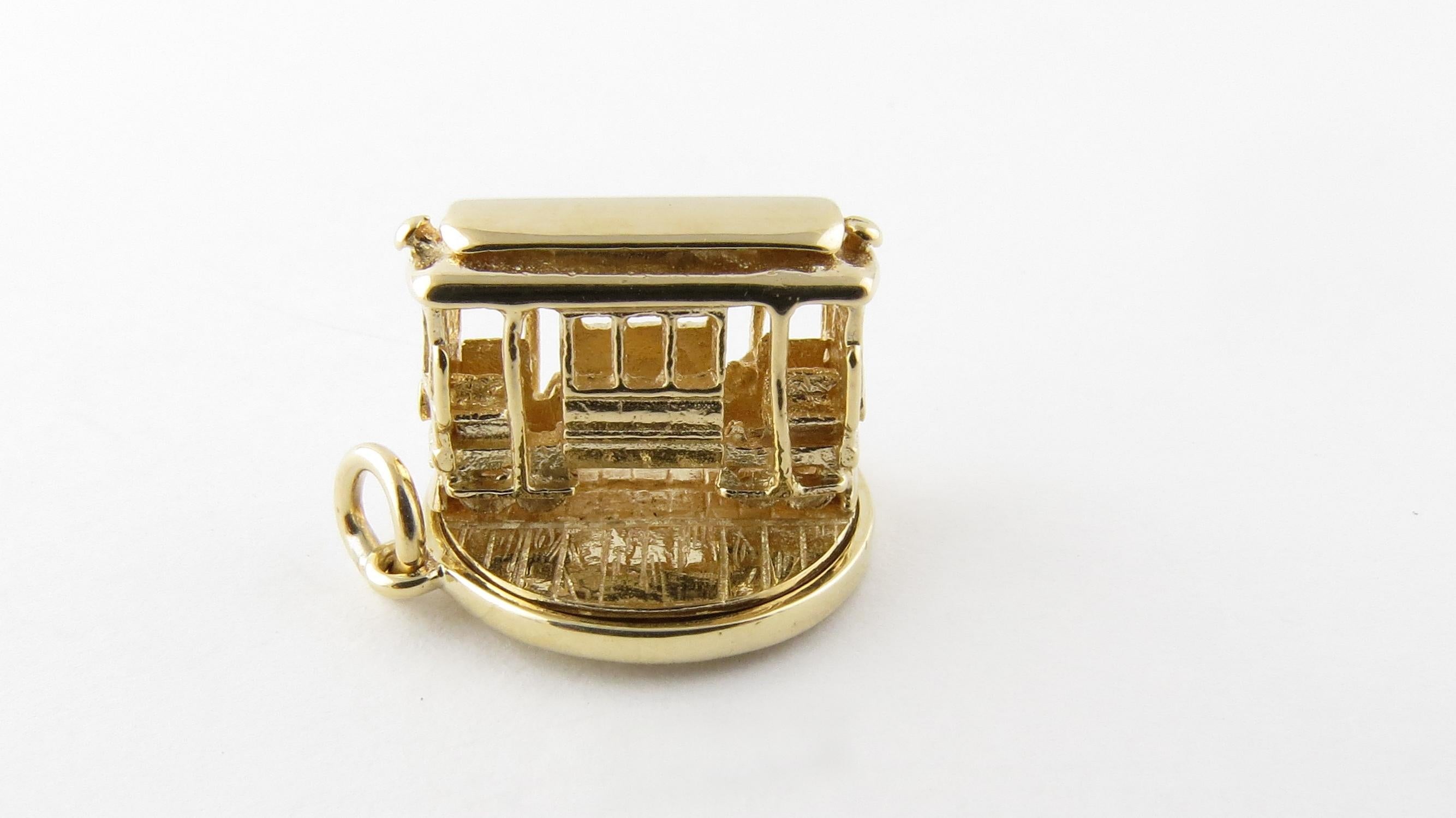 14 Karat Yellow Gold Articulated Cable Car Charm-

Take a ride on the trolley!

This lovely 3D charm features a miniature cable car that spins on its round base.  Meticulously detailed in 14K yellow gold.

Size:  12 mm x  16 mm (actual