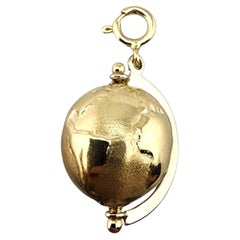 Ciondolo a forma di globo articolato in oro giallo 14 carati #23277