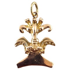 Charm a forma di uccello azteco in oro giallo 14 carati #18777