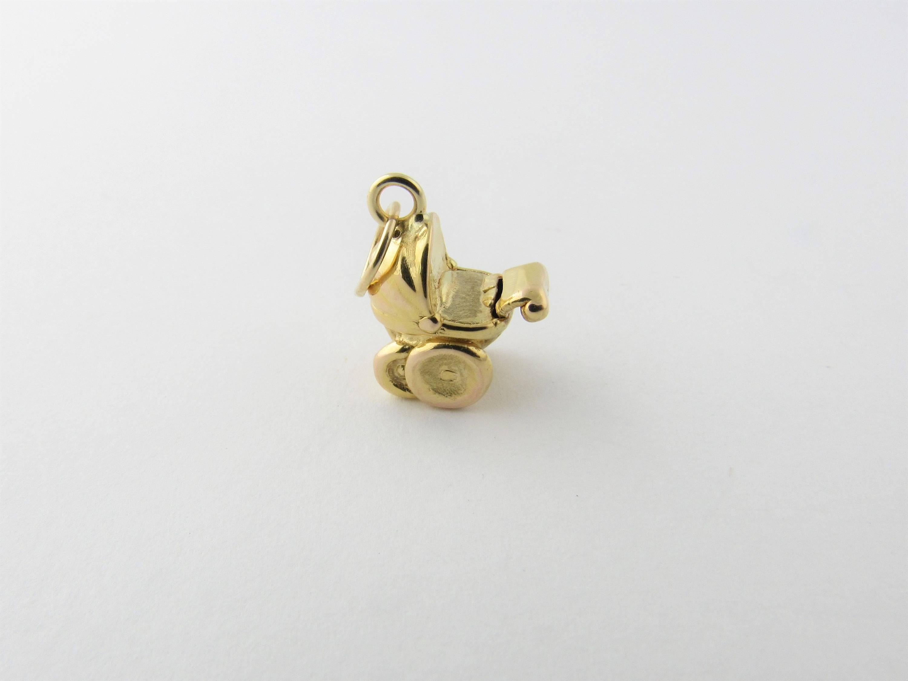 Vintage 14 Karat Yellow Gold Baby Pram Charm- 
Perfect gift for the new mom! 
This 3D charm depicts a miniature baby pram in beautifully detailed 14K yellow gold. 
Size:    13.5 mm x  12 mm (actual charm) 
Weight: 0.7 dwt. /   1.1 gr. 
Hallmark: 14K