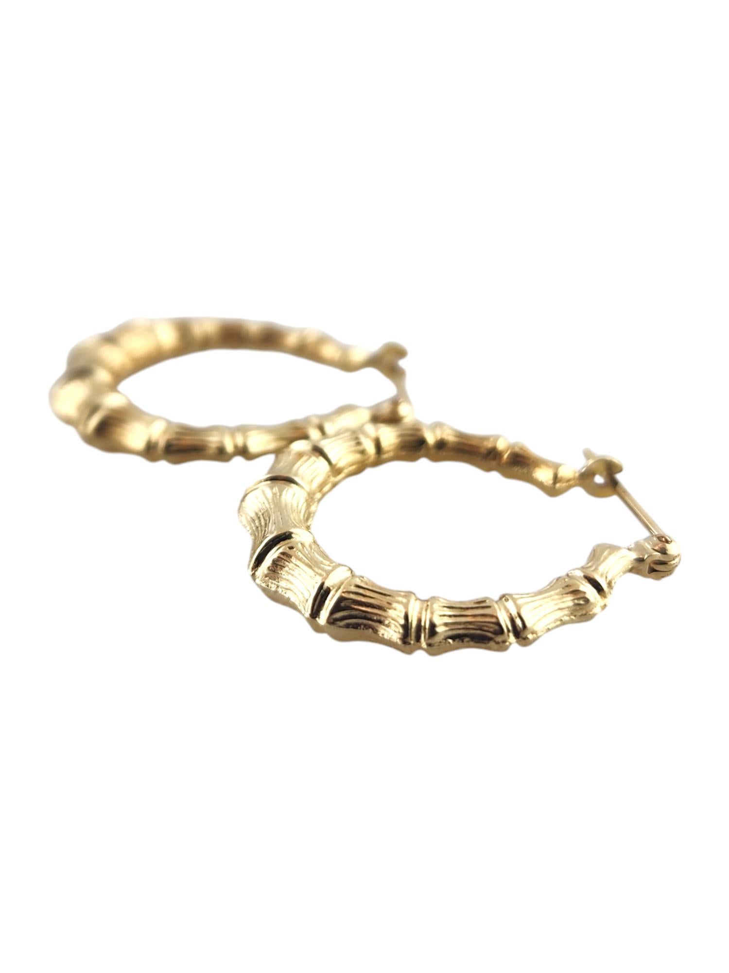 14 Karat Yellow Gold Bamboo Hoop Earrings

These beautiful 14K yellow gold bamboo hoops are going to look amazing on you!

Size: 23.3mm X 21.87mm X 3.85mm

Weight: 1.53 g/ 0.99 dwt

Hallmark: 14K

Very good condition, professionally polished.

Will