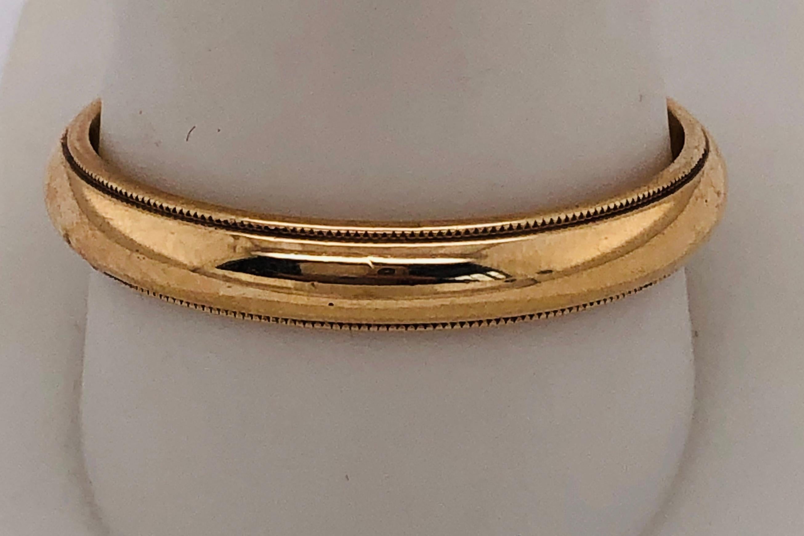 14Kt Yellow Gold Band/Wedding Ring
Size 11.5 with 4.40 grams total weight.

