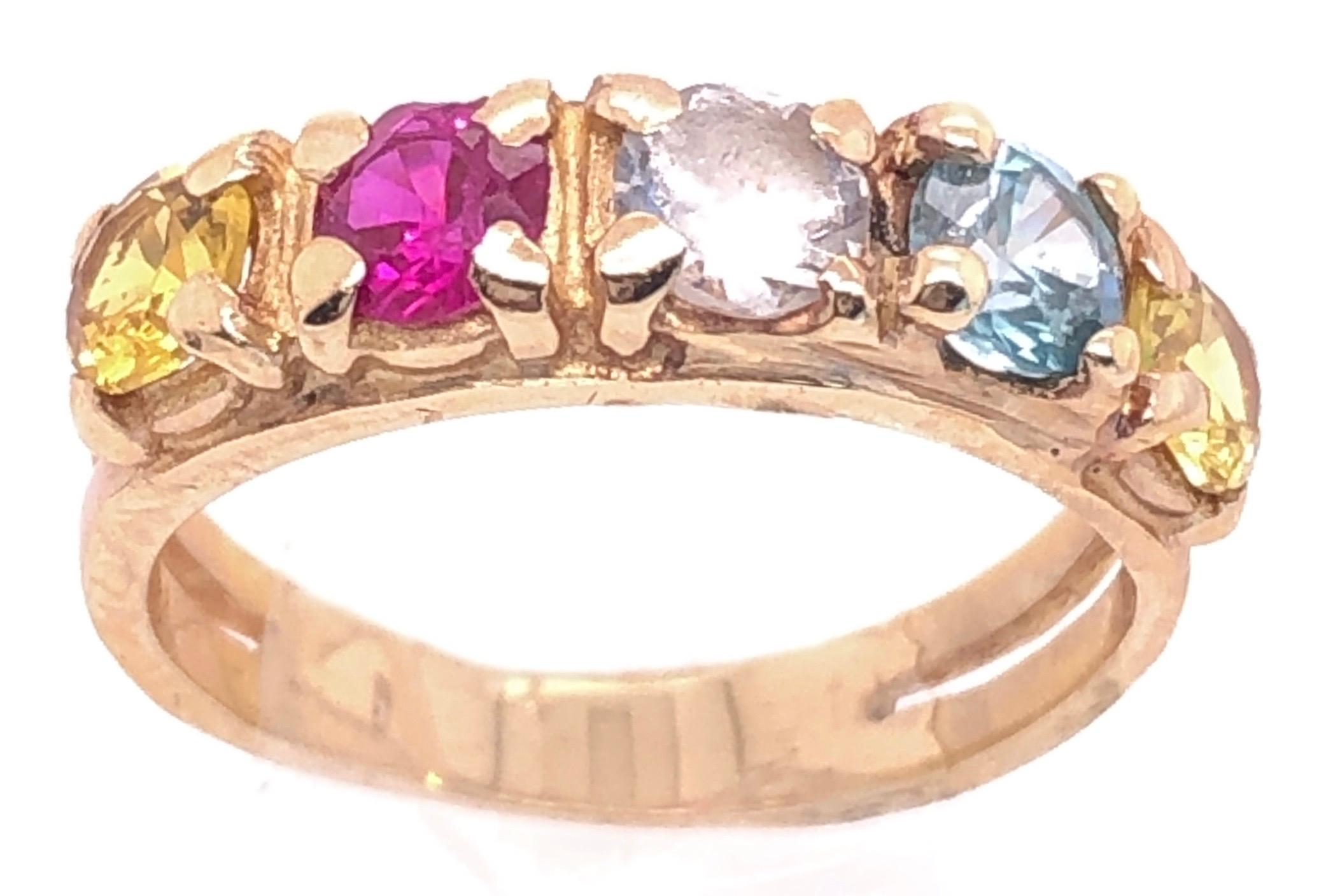 14 Karat Yellow Gold Band With Multi Colored Semi Precious Stones.
Blue Turquoise, Round Cubic zircon, Round Garnet, Round Citrine
Size 5.5
3 grams total weight.
