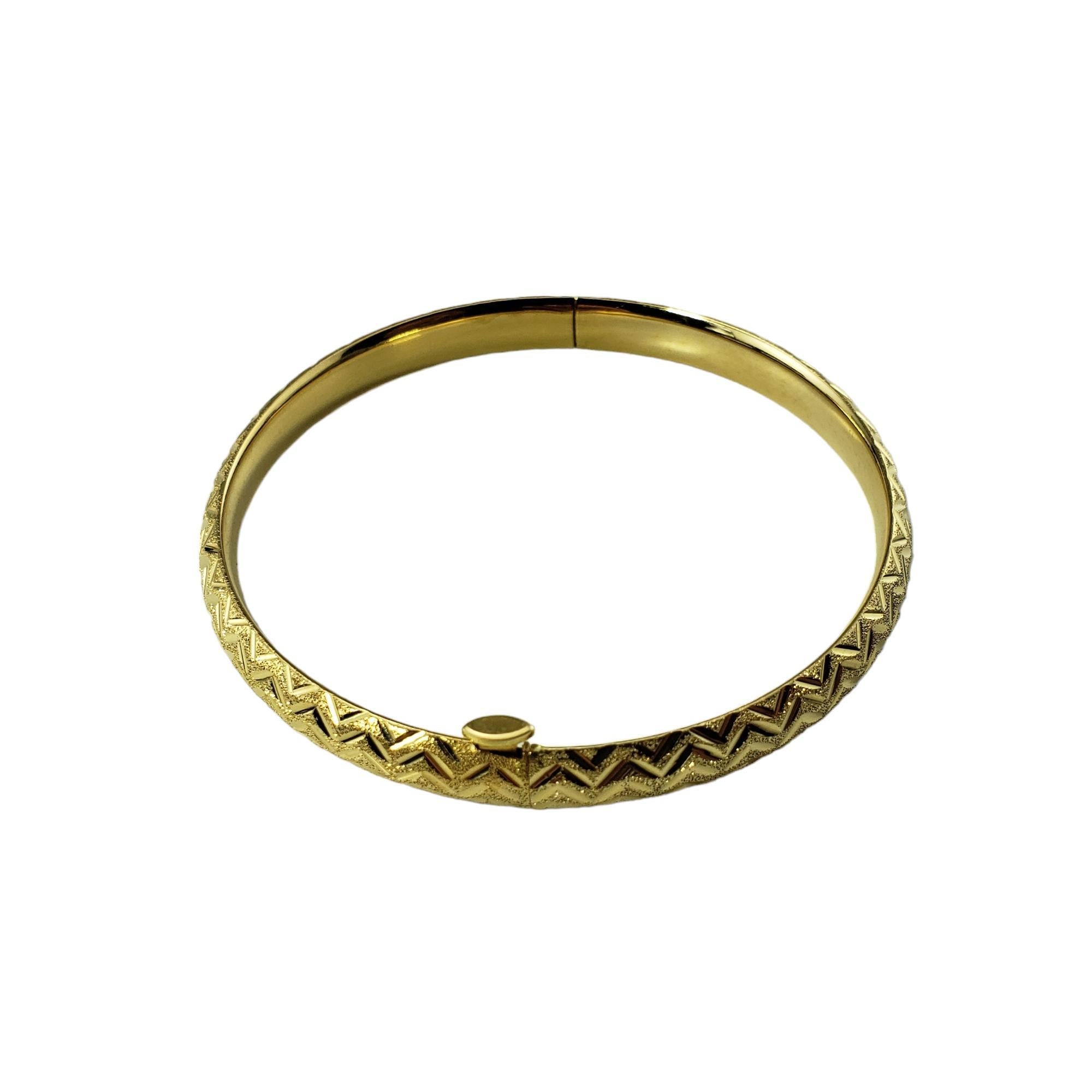 Vintage 14 Karat Yellow Gold Bangle Bracelet-

This elegant bangle bracelet is crafted in beautifully detailed 14K yellow gold.  Width:  6 mm.

Size: 7 inches

Stamped: 14K

Weight:  7.0 gr./  4.5 dwt.

Very good condition, professionally