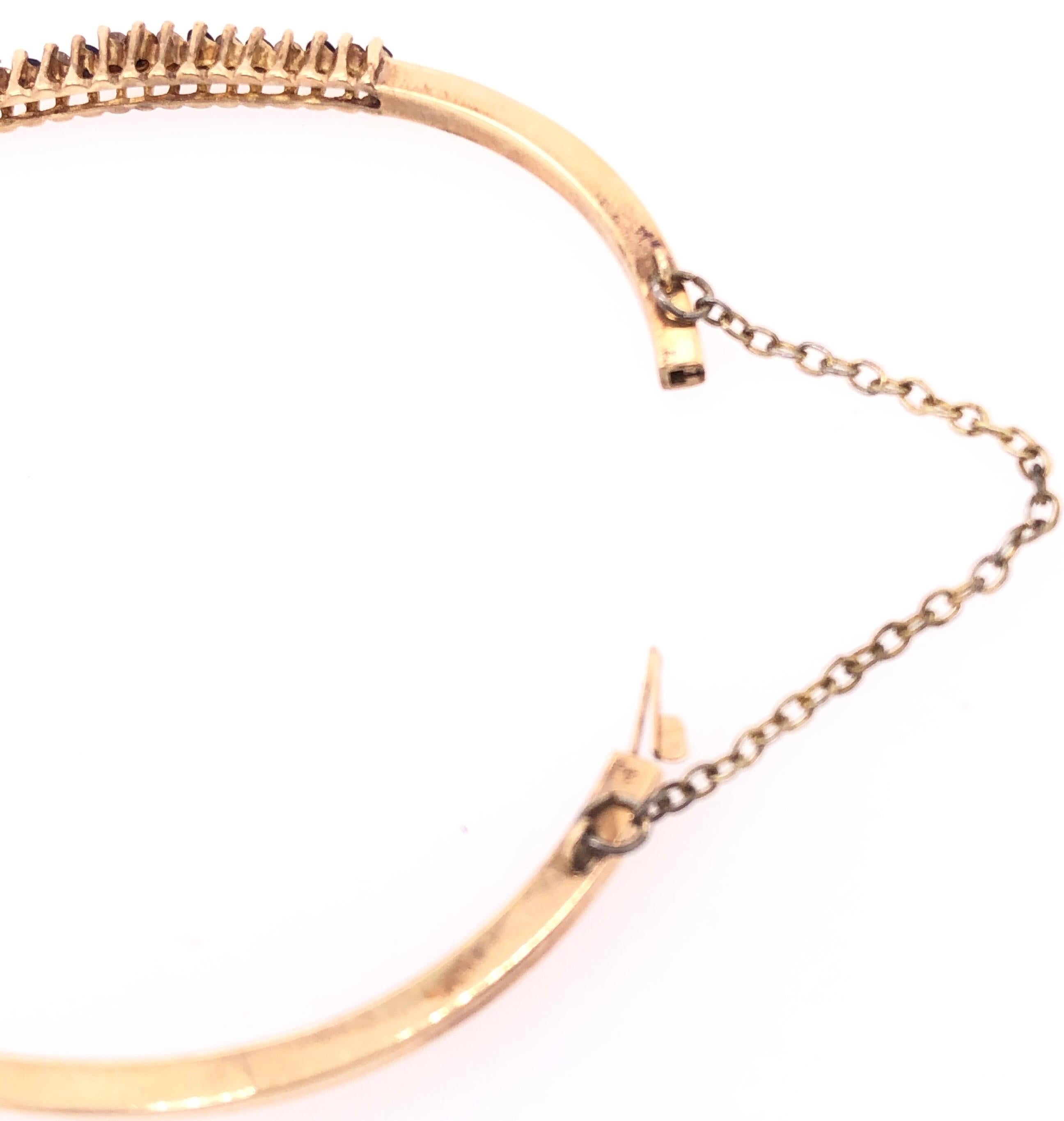 Modern 14 Karat Yellow Gold Bangle Bracelet with sapphires and Diamonds