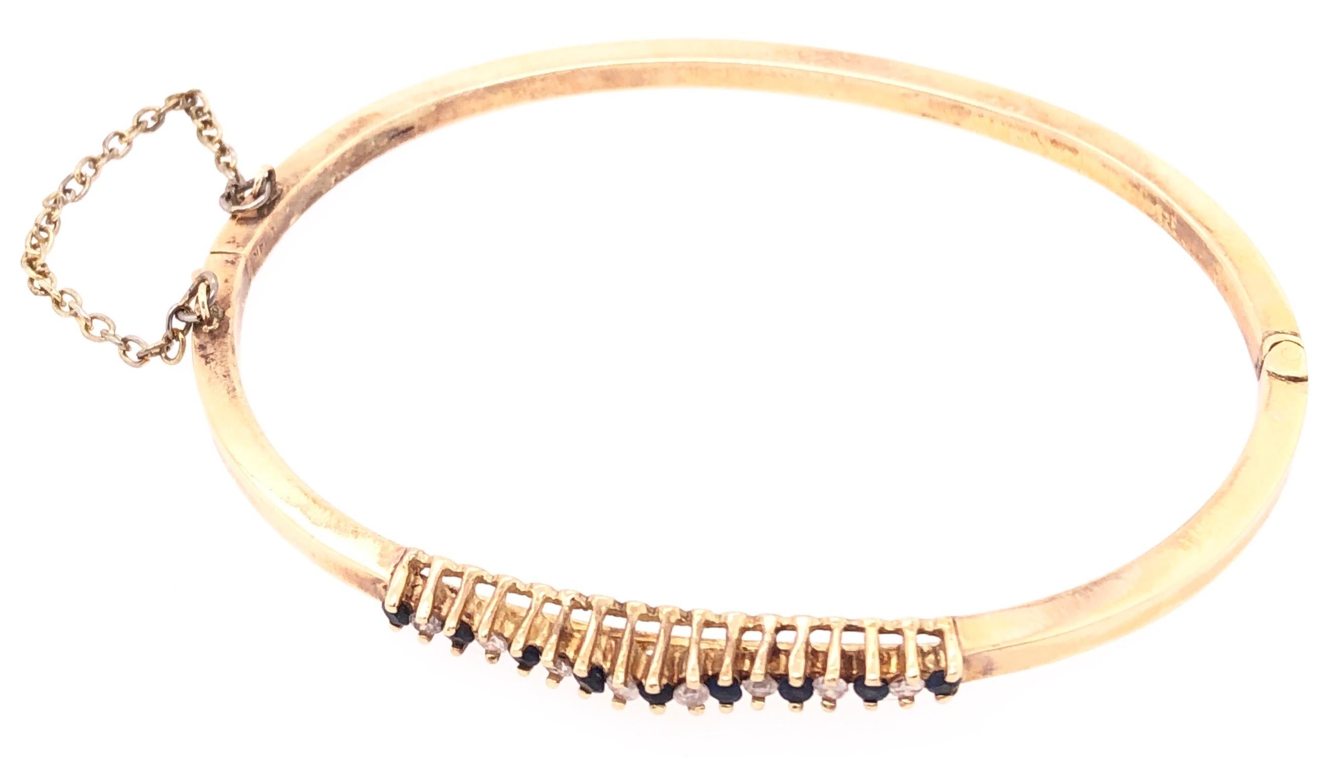 Women's 14 Karat Yellow Gold Bangle Bracelet with sapphires and Diamonds
