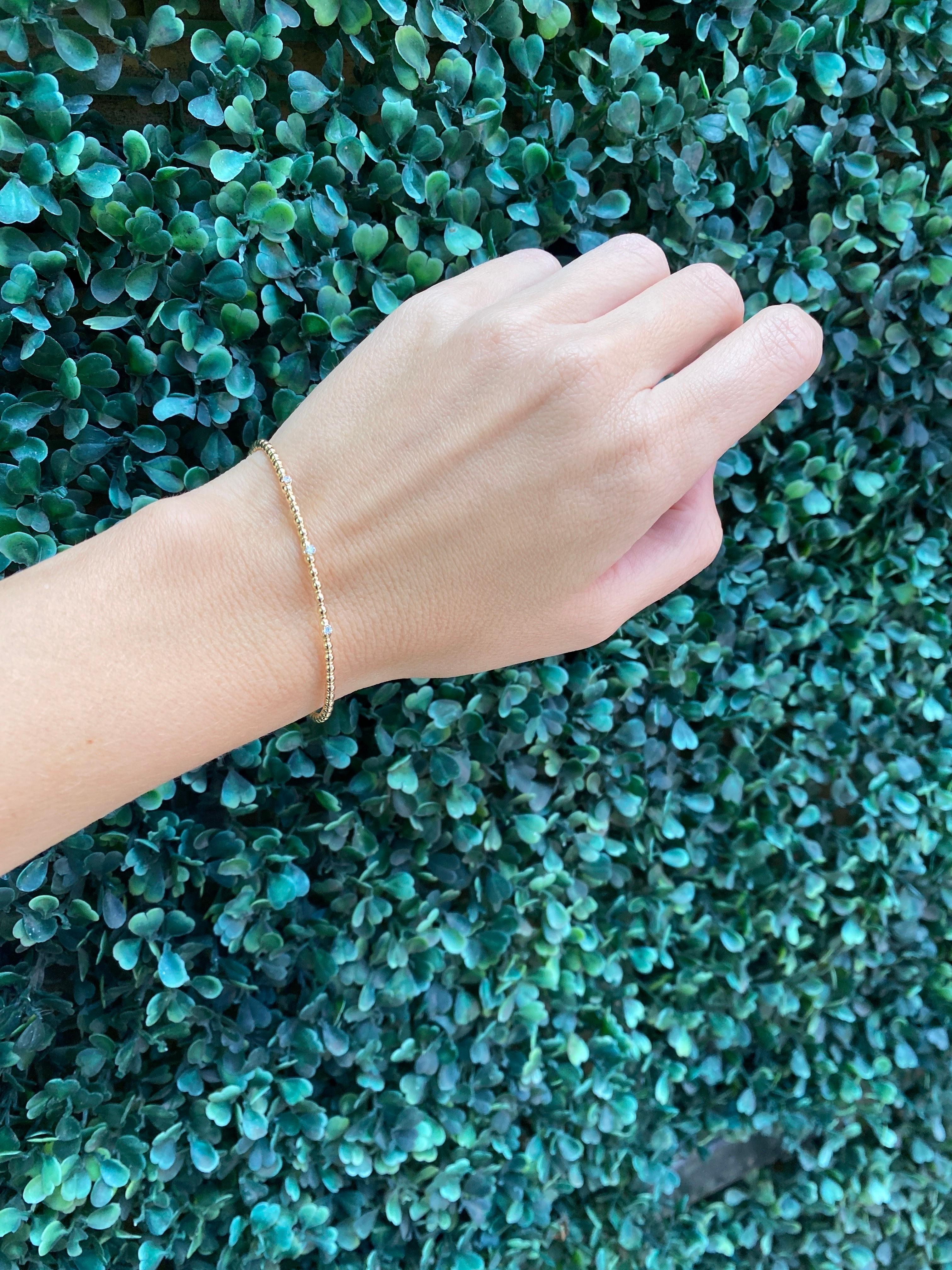 Armreif aus 14 Karat Gelbgold mit Perlen und flexiblem Diamanten 8