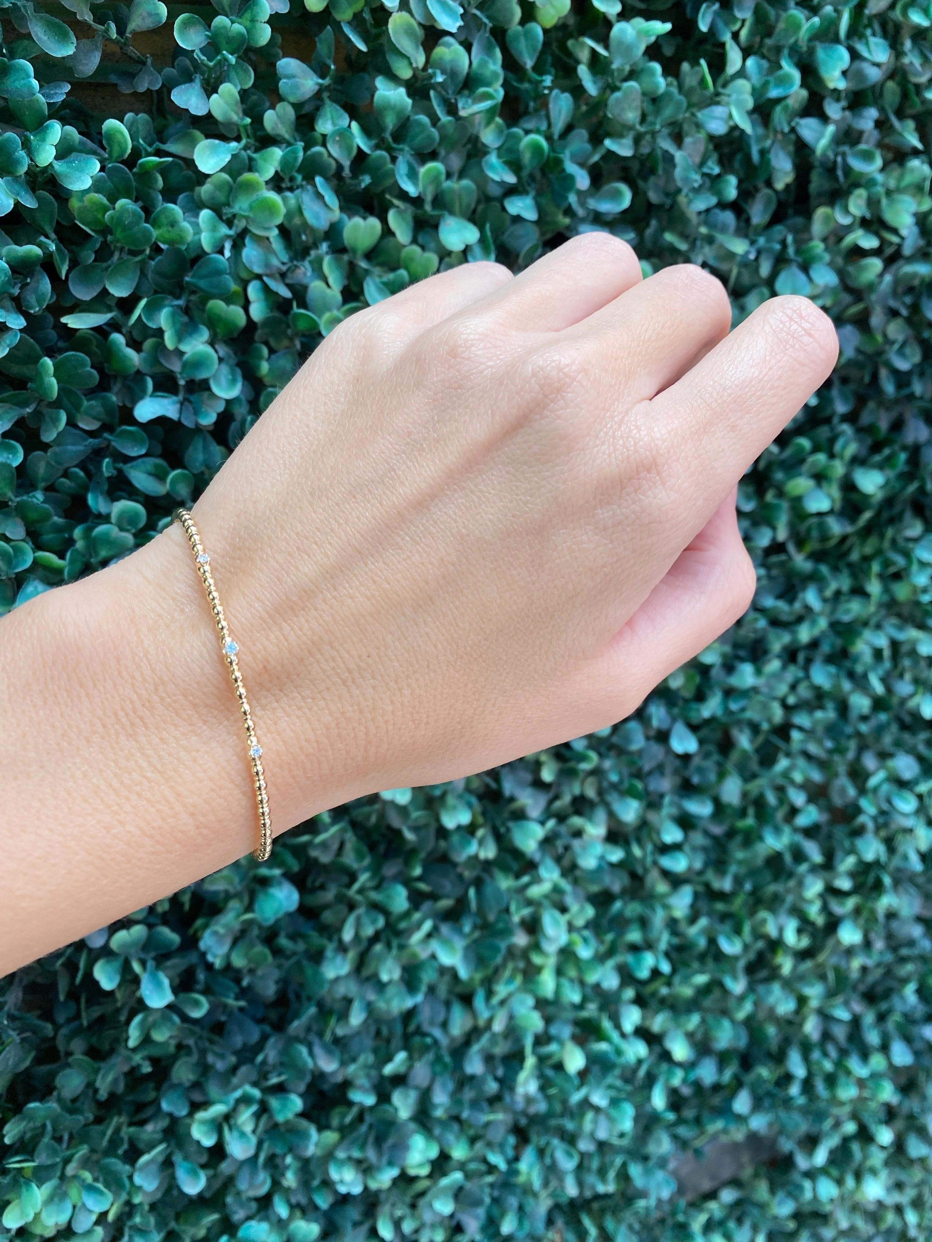 Armreif aus 14 Karat Gelbgold mit Perlen und flexiblem Diamanten 9