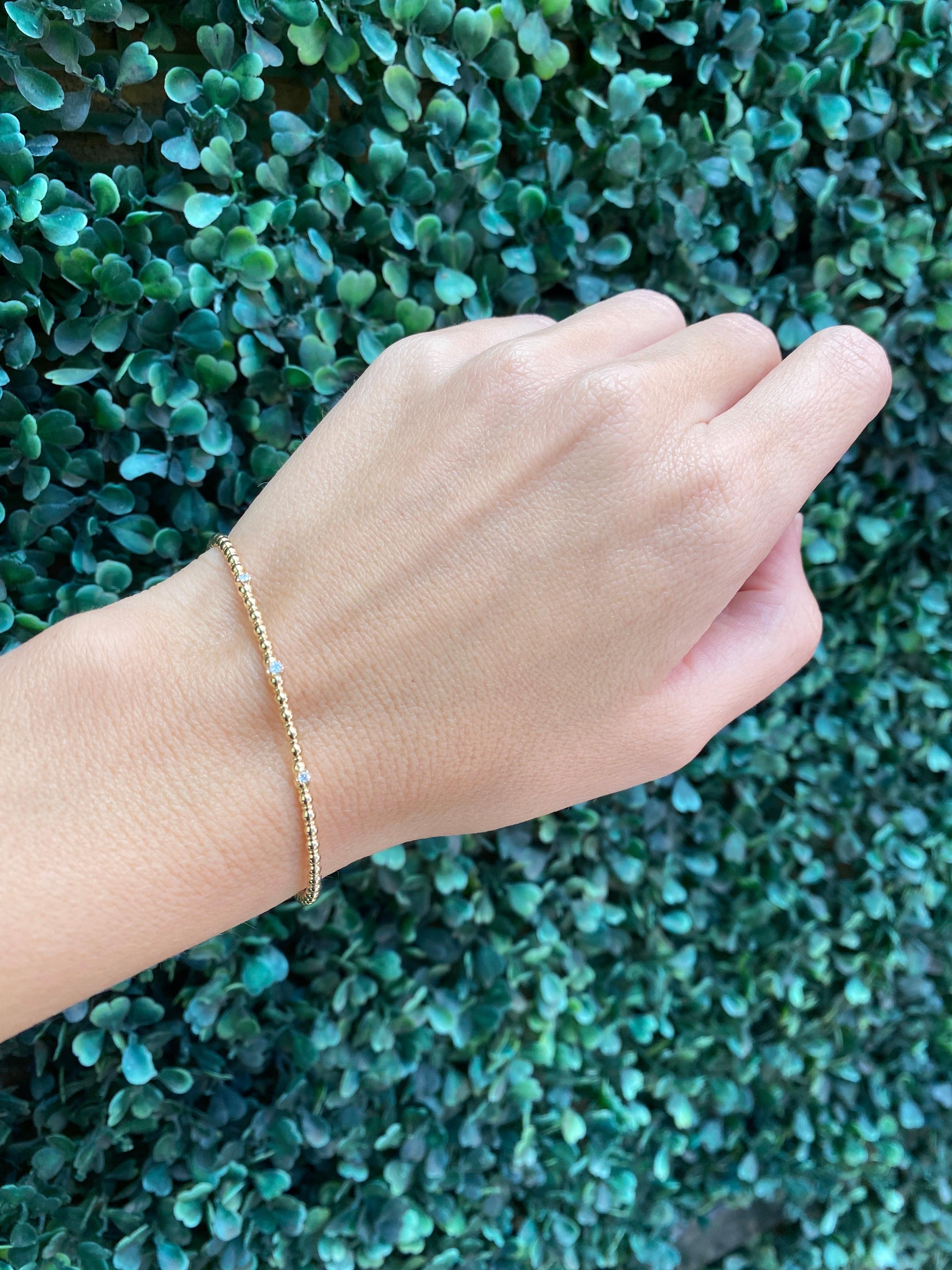 Armreif aus 14 Karat Gelbgold mit Perlen und flexiblem Diamanten 11