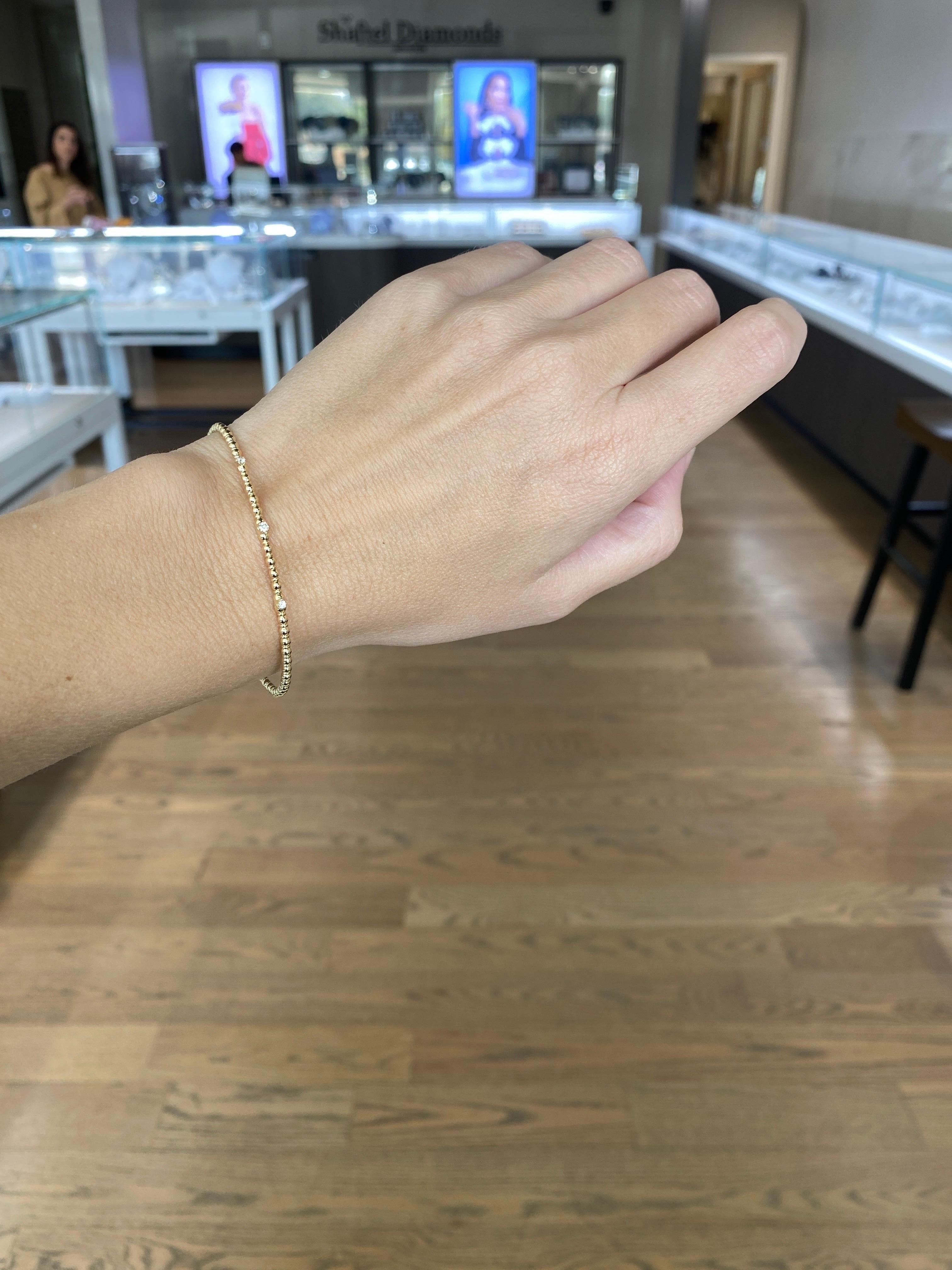Armreif aus 14 Karat Gelbgold mit Perlen und flexiblem Diamanten 1