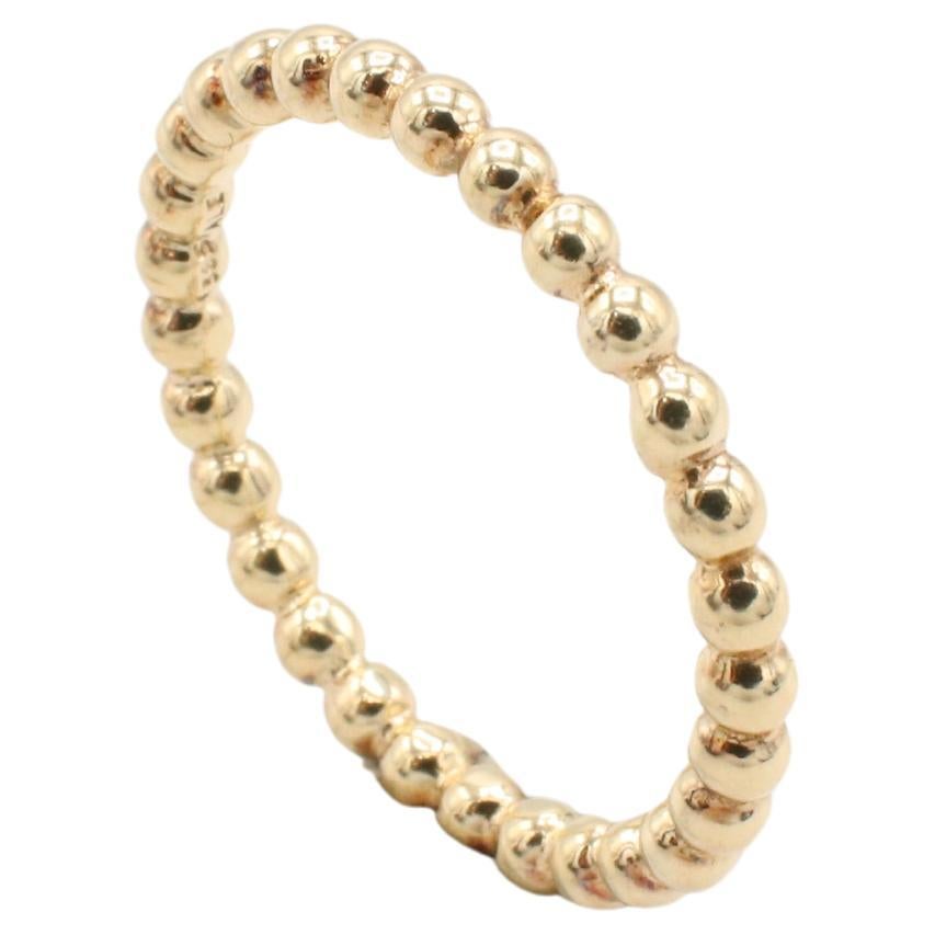 14 Karat Yellow Gold Beaded Ball Band Stacking Ring 
Metal: 14k yellow gold
Weight: 2.32 grams
Size: 6.75 (US)
Width: 2mm
Height: 2mm
NT 111198-4