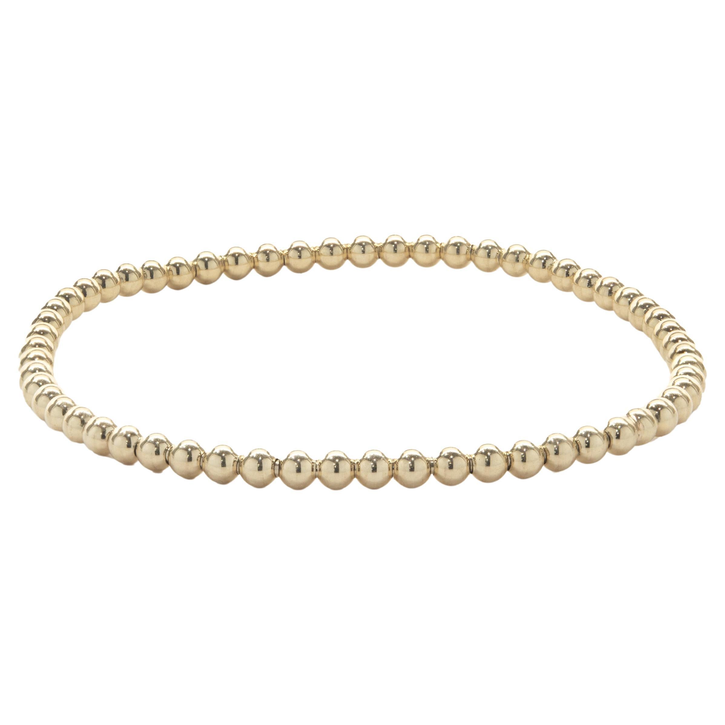 Bracelet flexible en or jaune 14 carats en vente