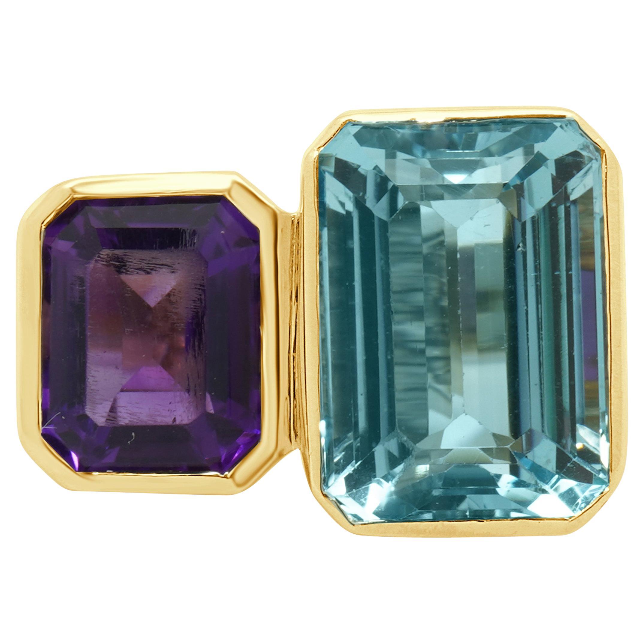 Anello in oro giallo 14 carati con castone incastonato di topazio blu e ametista