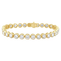 Tennisarmband aus 18 Karat Gelbgold mit Diamanten in Lünettenfassung und Inline