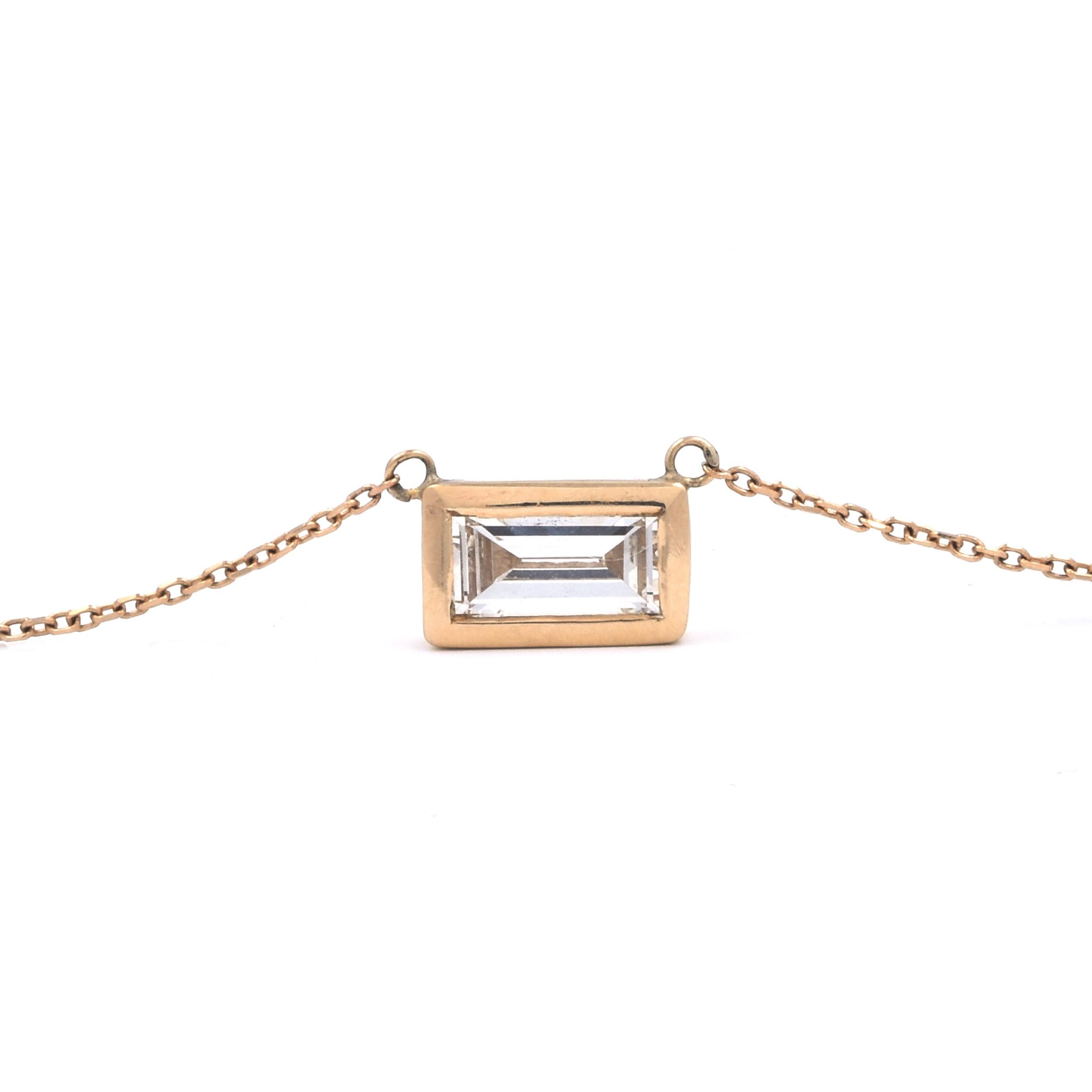 Designer: custom
Material: 14K yellow gold
Diamonds: 1 emerald cut = 1.00ct
Color: G
Clarity: SI1
Dimensions: necklace measures 20-inches
Weight: 2.46 grams
