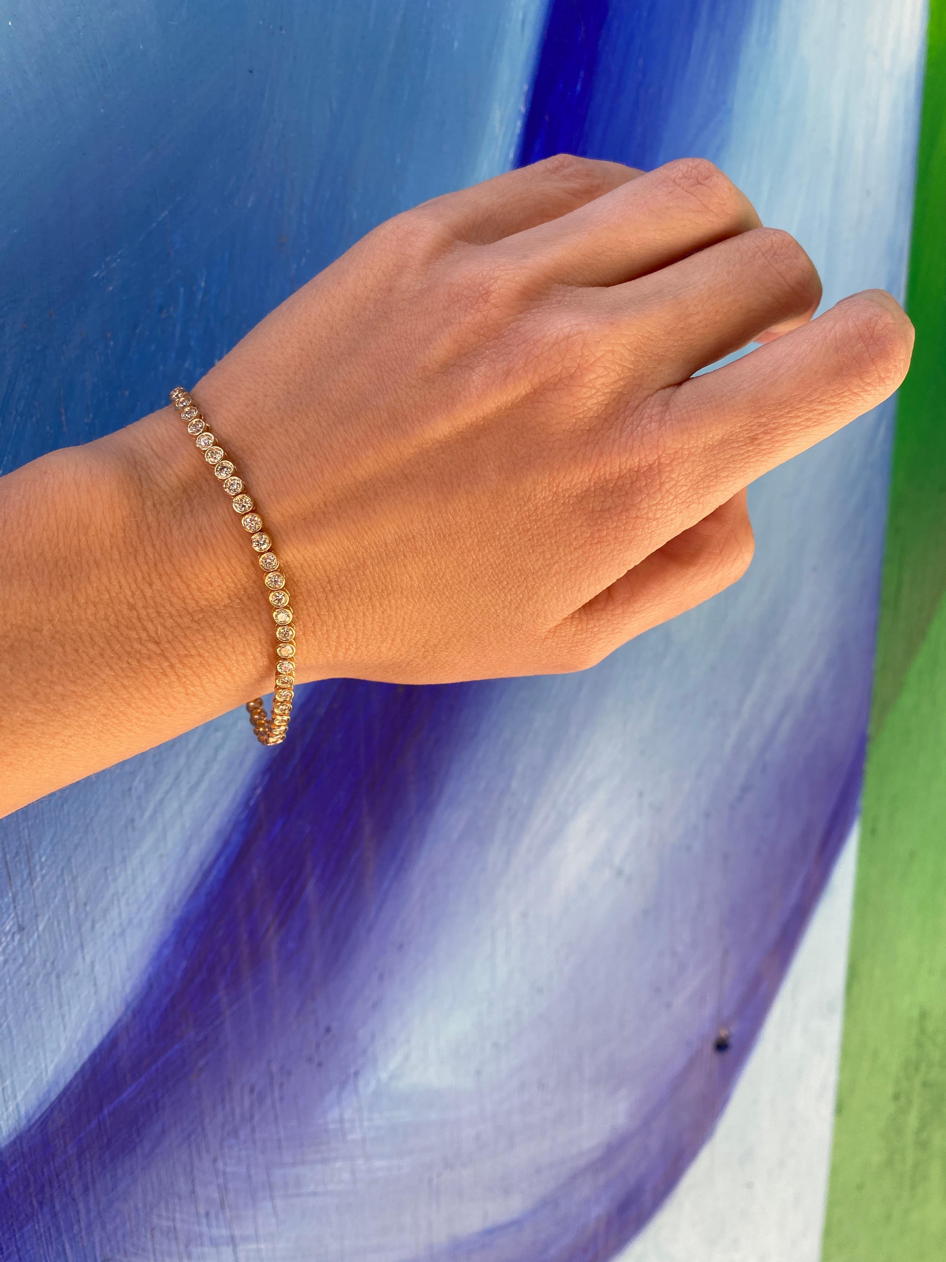 Round Cut 14 Karat Yellow Gold Bezel Set Diamond Tennis Bracelet
