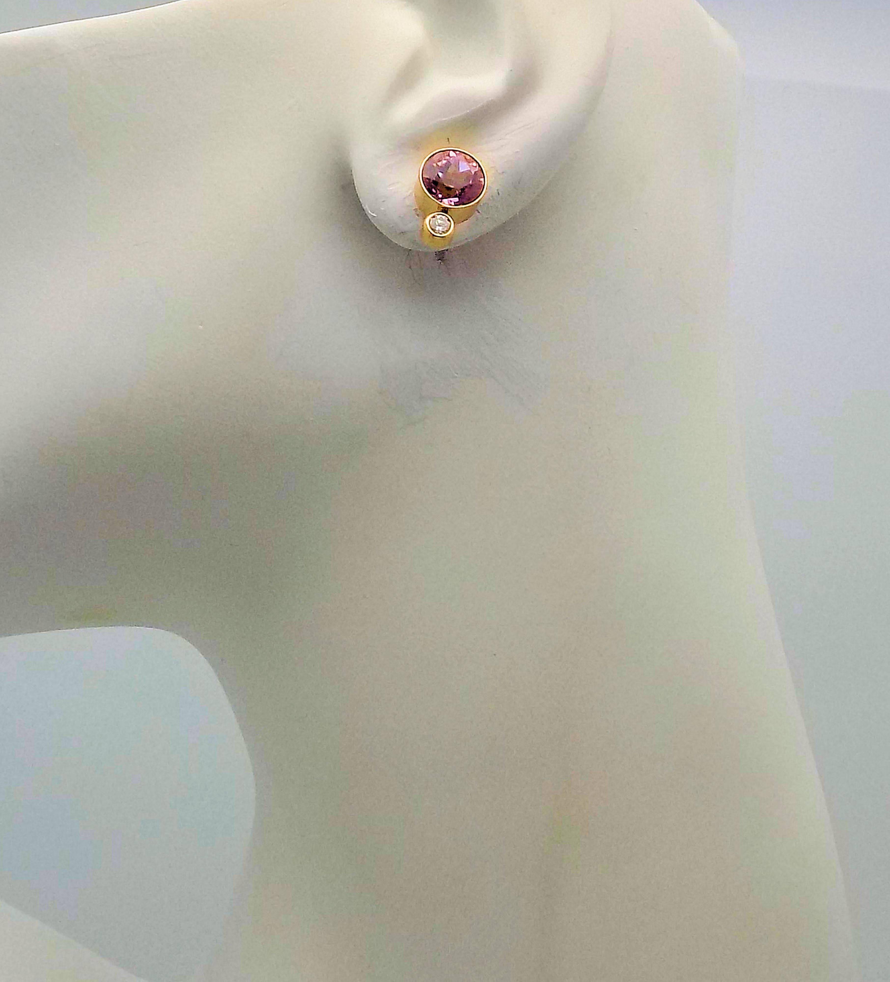Classic Design to these Beautiful Stud Earrings in 14 Karat Yellow Gold  Featuring 2 Round  Diamond Cut Kunzites 5.75 Carat Total Weight, Fine Color, in Bezel Setting; 2 Round Brilliant Diamonds 0.20 Carat Total Weight VS, H; 3 DWT or 4.67 Grams.