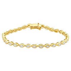 Bracciale tennis in linea in oro giallo 14 carati con castone e diamanti taglio marquise incastonati
