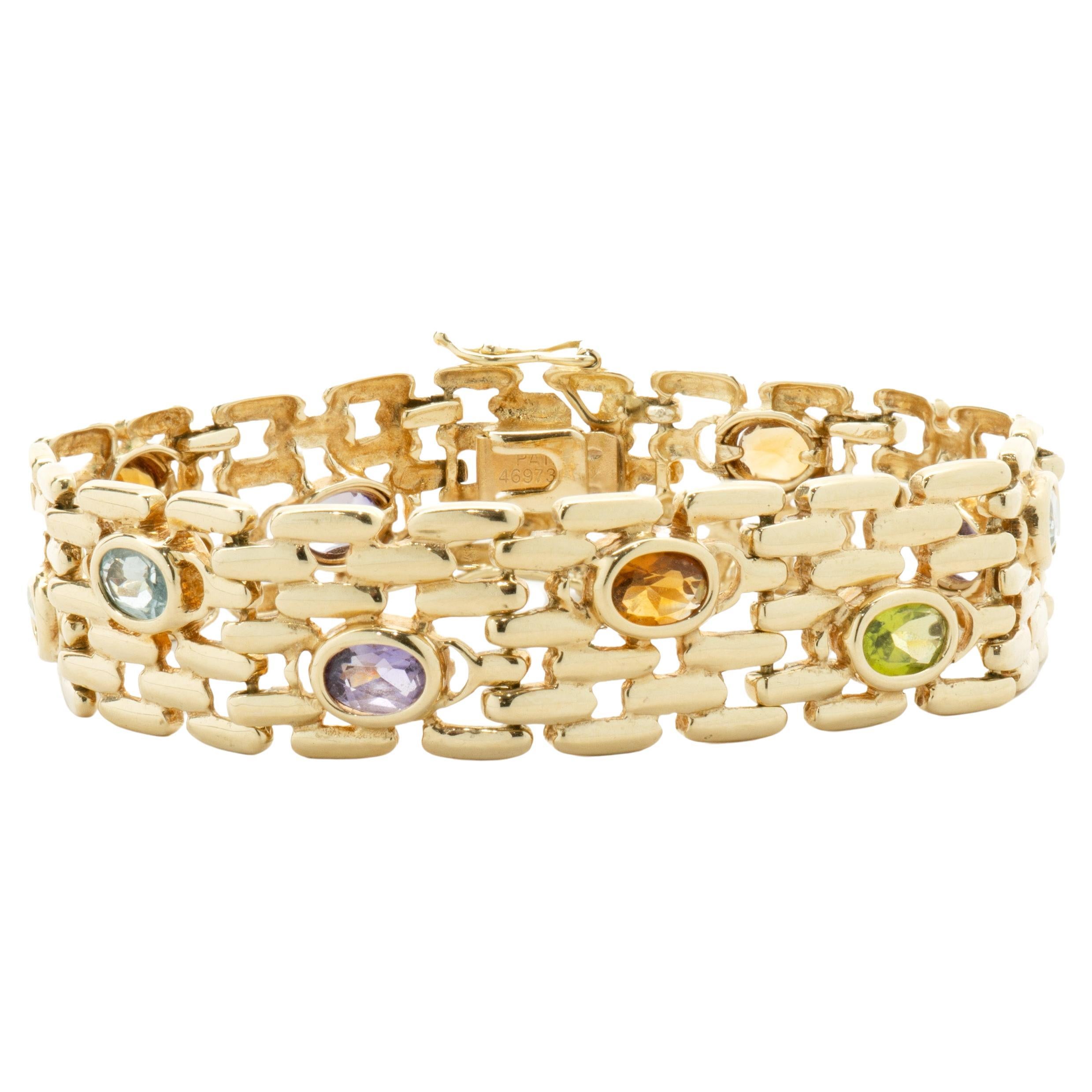14 Karat Yellow Gold Bezel Set Multi Gemstone Station Bracelet For Sale