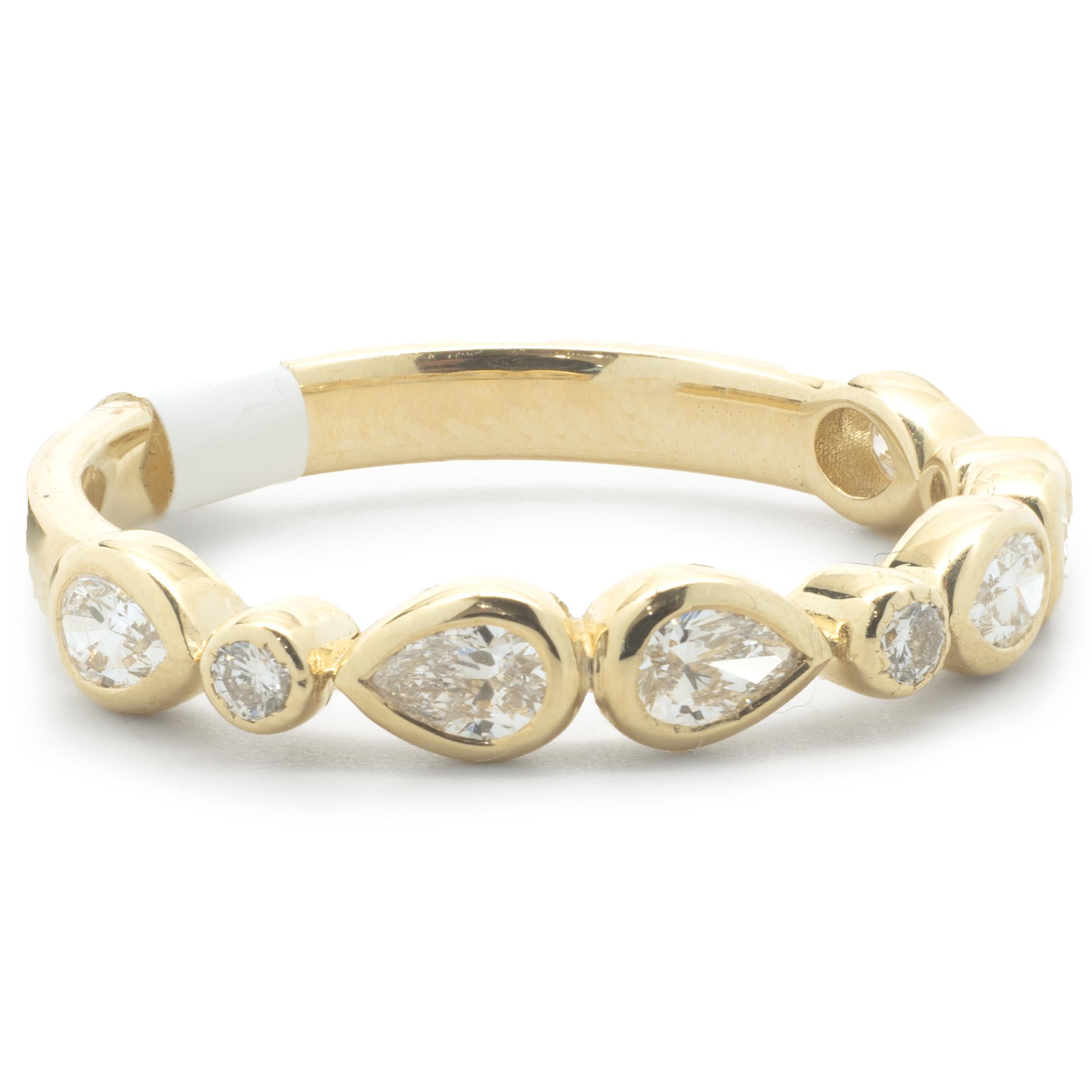 Designer: Custom
Material: 14K yellow gold
Diamonds: 9 pear and round brilliant cut = .50cttw
Color: H
Clarity: VS1
Size: 6
Dimensions: ring measures 3.44mm in width
Weight: 2.54 grams
