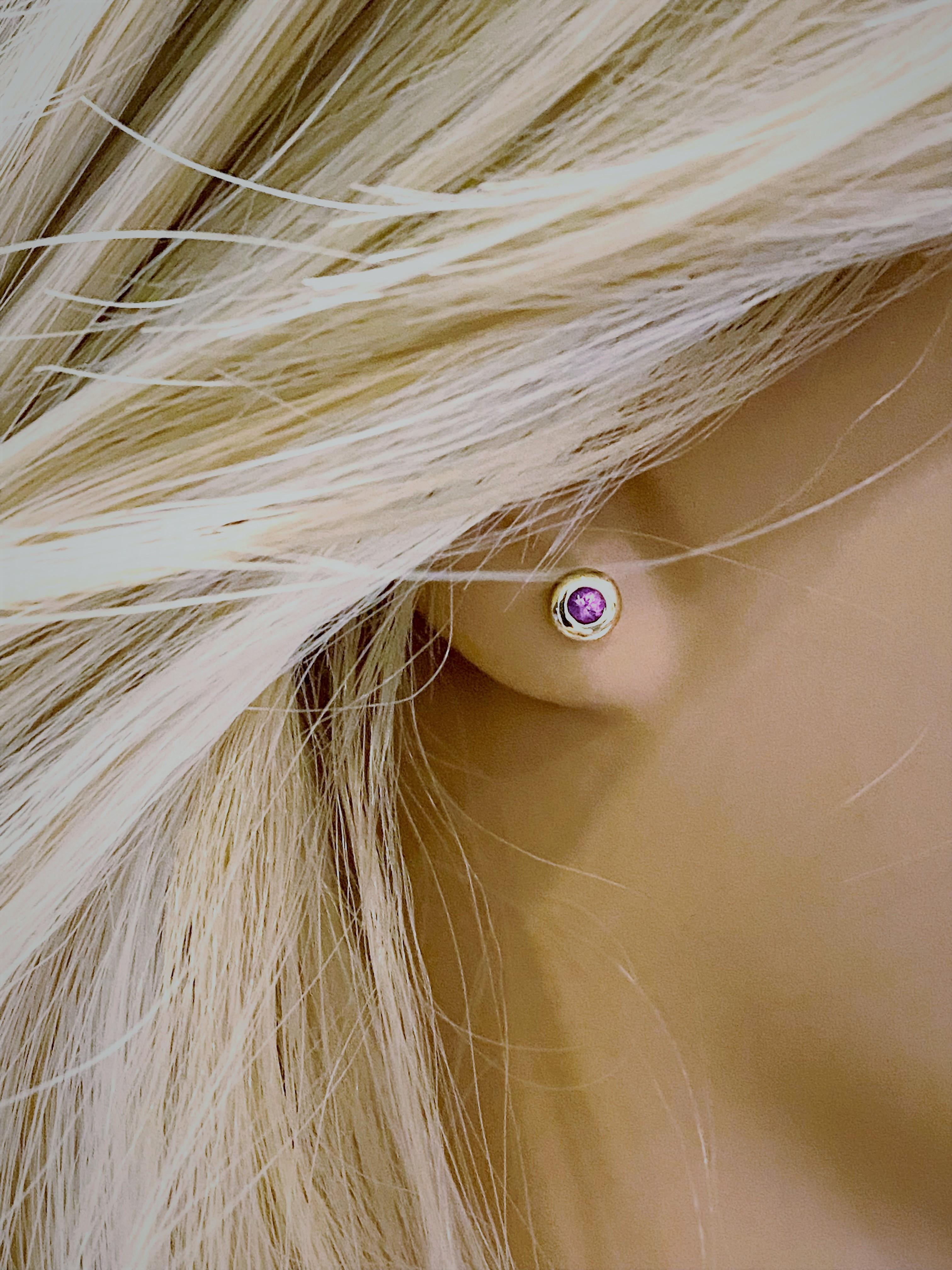 14 karat yellow gold round pink sapphire stud earrings
Two round pink sapphires measuring 3 millimeters each 
Pink sapphire hue tone color is bubblegum pink
Pink sapphires weighing 0.30   
New Earrings
Handmade in the USA
The 14 karat gold earrings