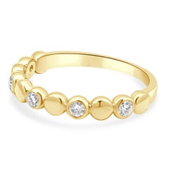 14 Karat Yellow Gold Bezel Set Round Diamond Station Band
