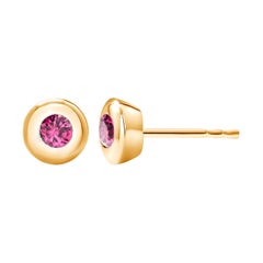 14 Karat Yellow Gold Bezel Set Ruby Stud Earrings Weighing 0.30 Carat